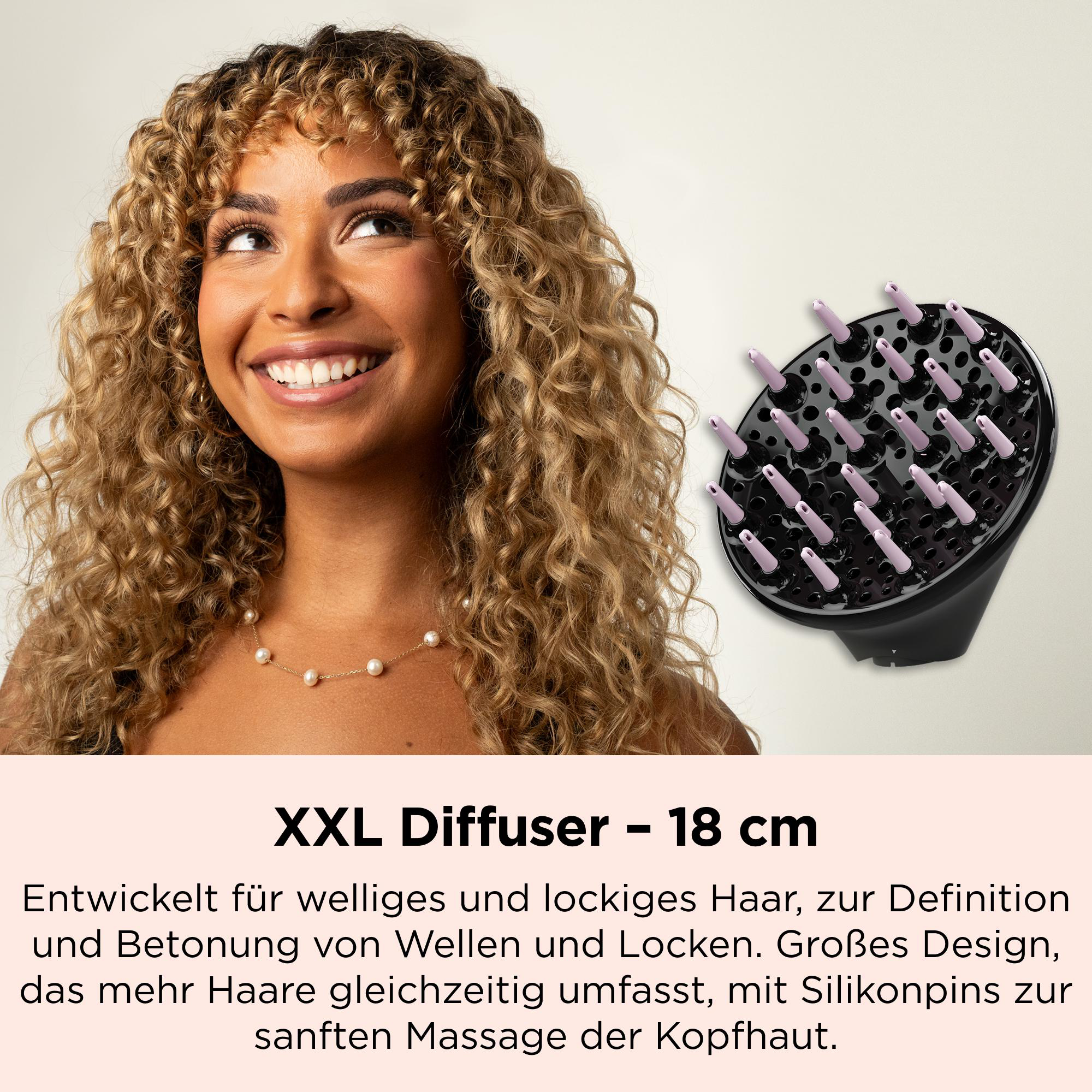 Frau mit blonden Locken und schwarzer XXL-Diffusor-Aufsatz mit lila Pins.