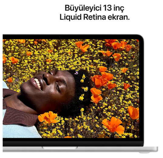 13 inç ekrana sahip dizüstü bilgisayar sarı çiçek tarlasındaki bir kişiyi gösteriyor.