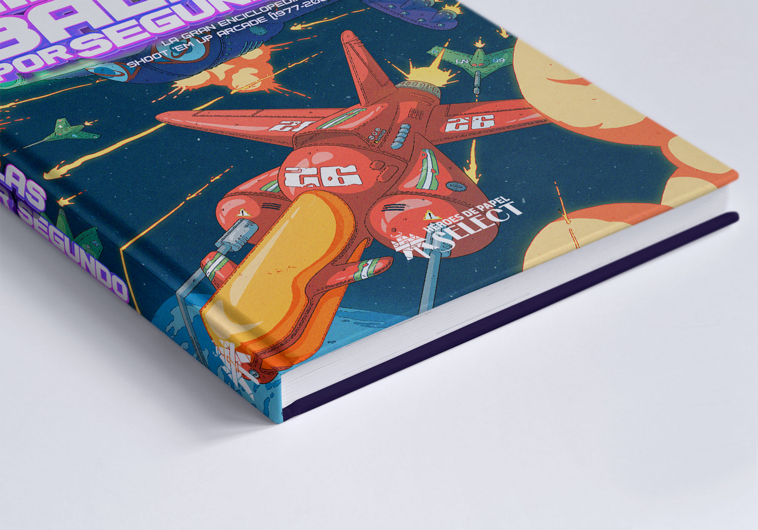 Un libro con una ilustración de batalla espacial retro en la portada.