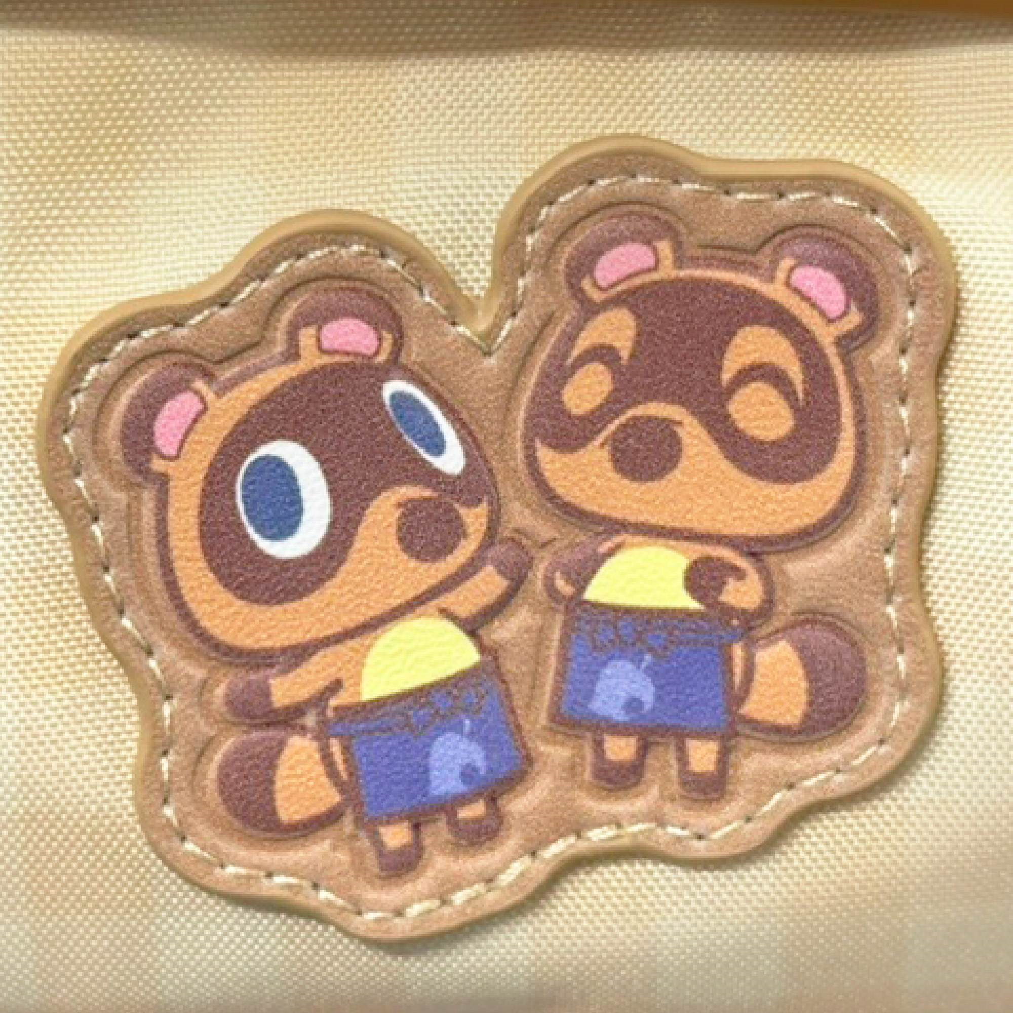Toppa in tessuto con due tanuki marroni di Animal Crossing.