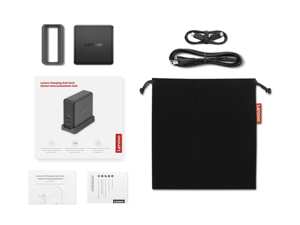 Una base de carga Lenovo GaN con adaptador de corriente, cables, soporte, manuales y una bolsa de tela negra.
