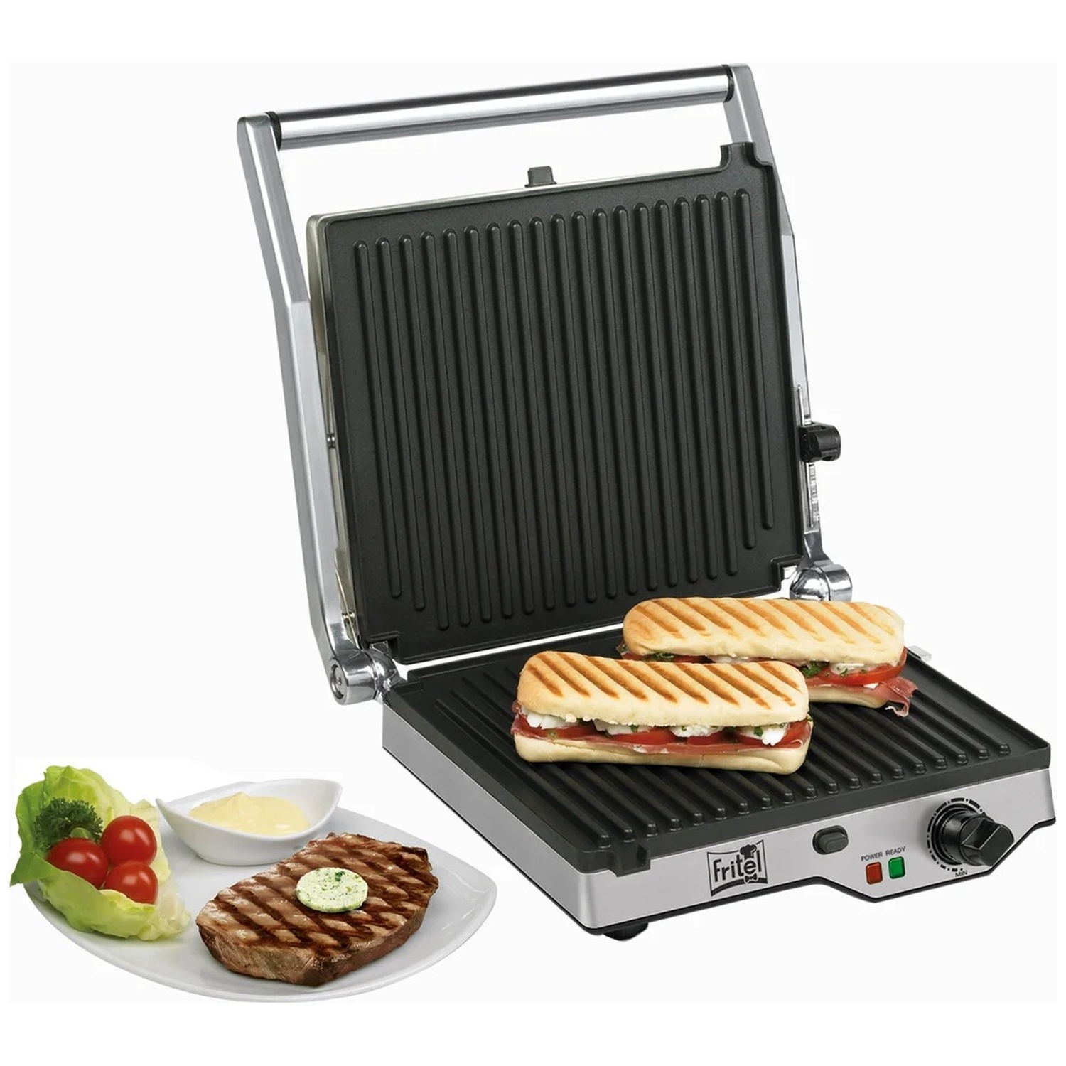 Un gril ouvert avec des paninis, à côté d'une assiette avec un steak, de la salade et de la sauce.