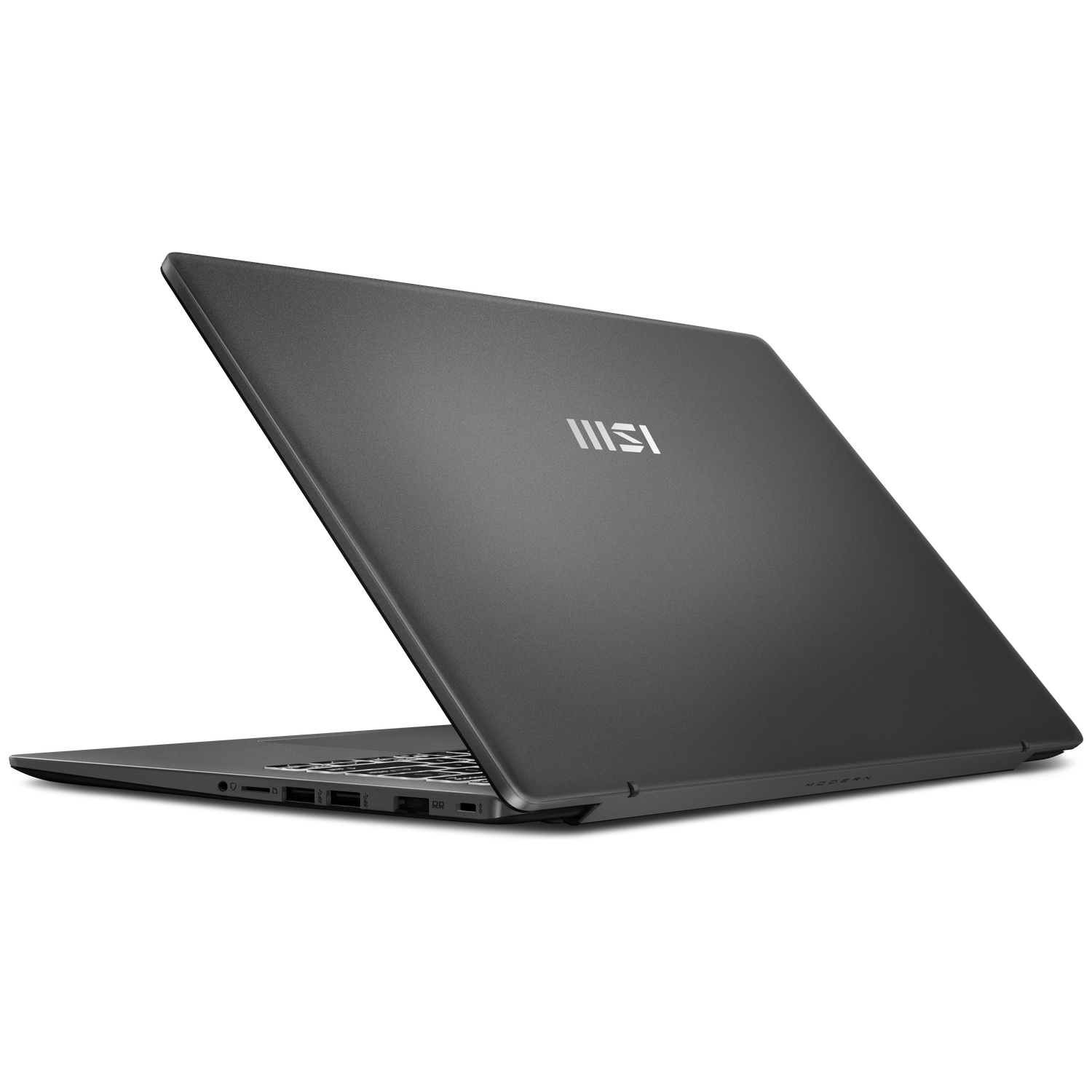 Un ordinateur portable MSI gris sur une surface blanche, montrant sa partie arrière fermée.