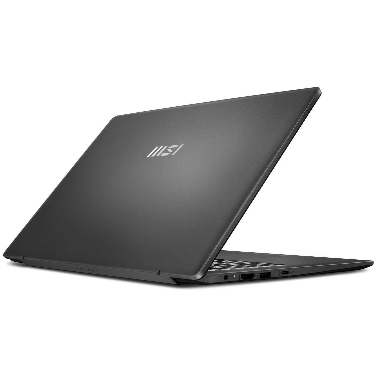 Un ordinateur portable MSI gris repose sur une surface blanche, vu de l'arrière fermé avec le logo argenté.