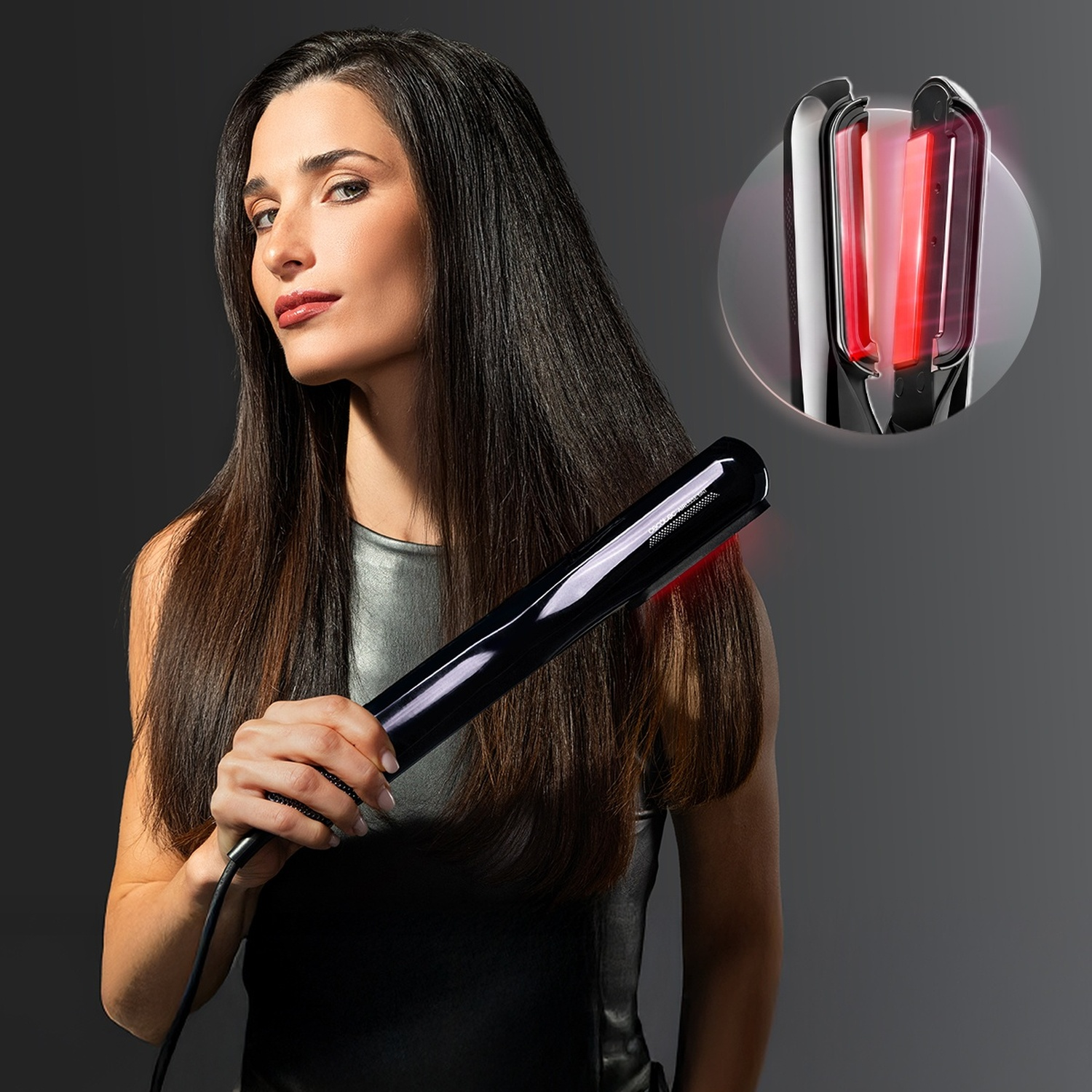 Una donna con capelli lunghi e lisci tiene una piastra per capelli nera, con un primo piano dell'elemento riscaldante rosso.
