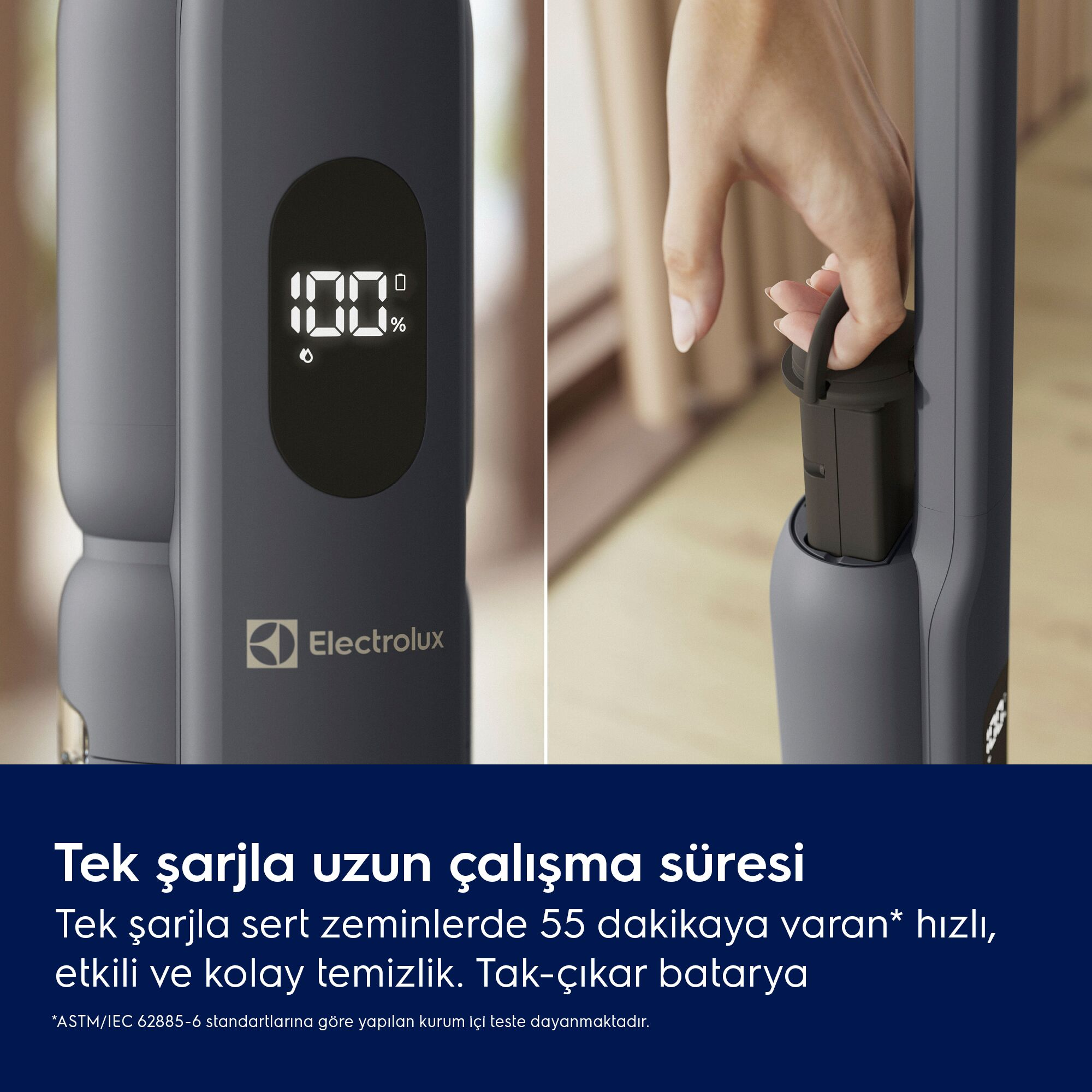 Ekranlı bir süpürge yüzde 100 gösteriyor ve bir el pili dışarı çekiyor.