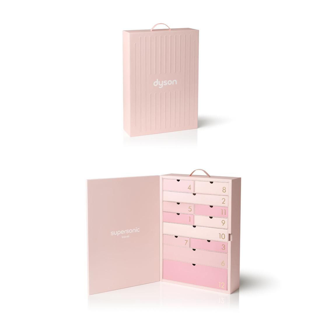Rosa Dyson Adventskalender, geschlossen und geöffnet mit nummerierten Schubladen.