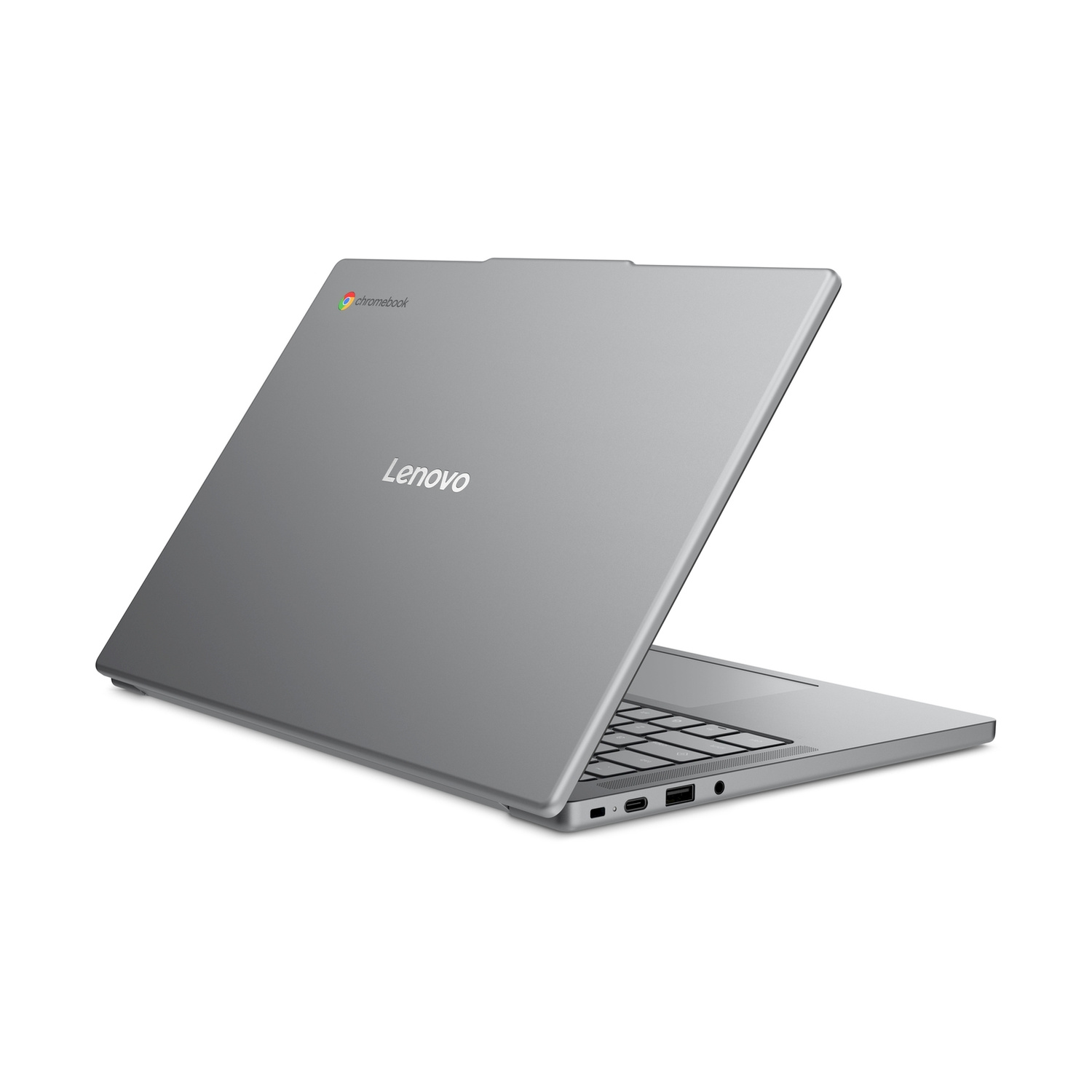 Un laptop Lenovo Chromebook argento è posizionato su una superficie bianca con logo e porte visibili.