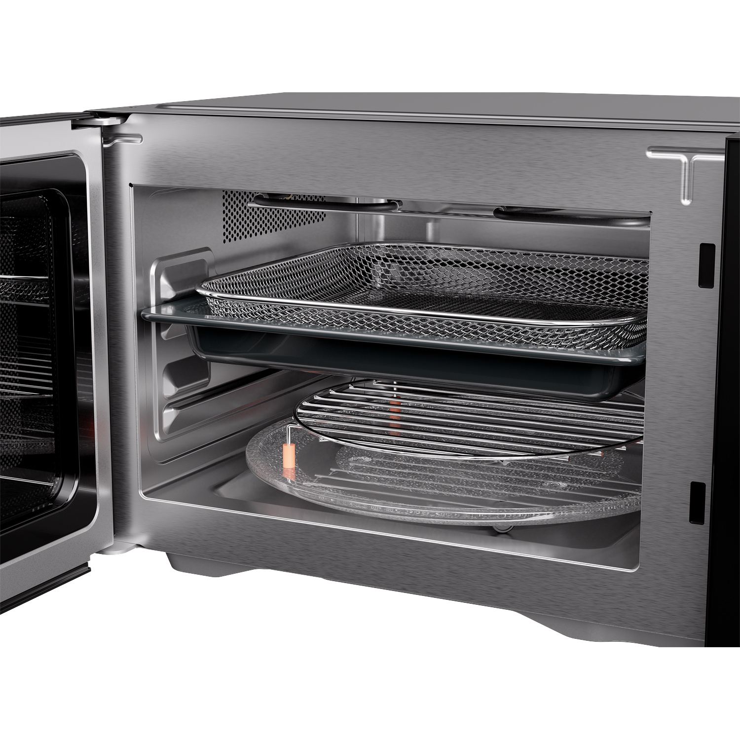 Open stainless steel microwave oven with a mesh basket and grilling rack inside.