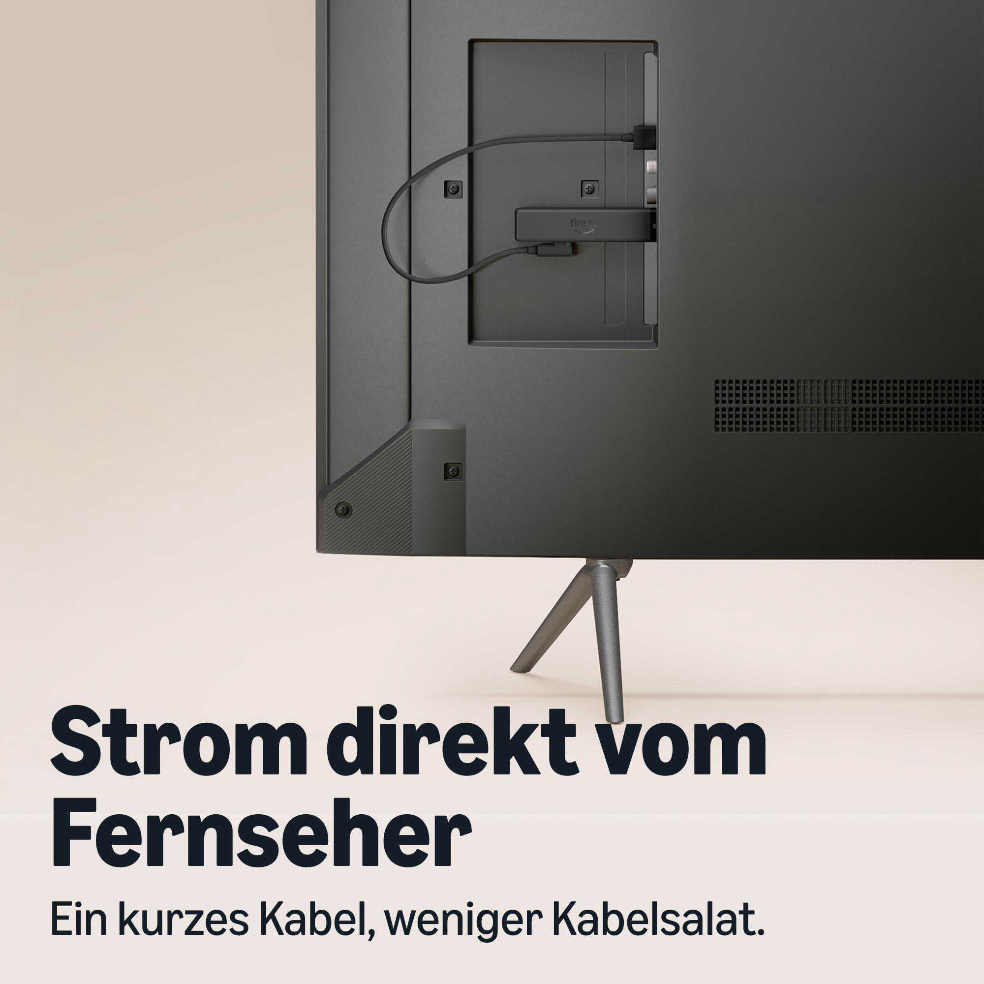 Rückseite eines Fernsehers mit einem angeschlossenen Fire TV Stick und Text auf Deutsch.