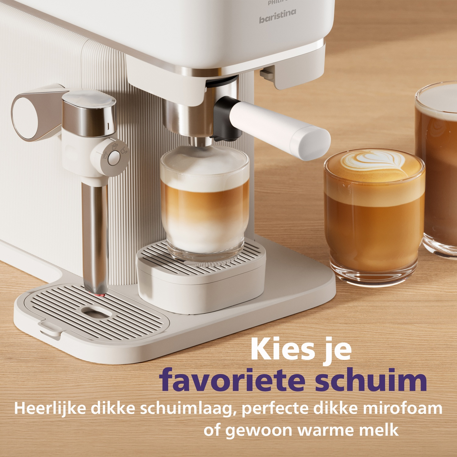 A white espresso machine pours coffee into a glass, with another glass of latte art nearby.