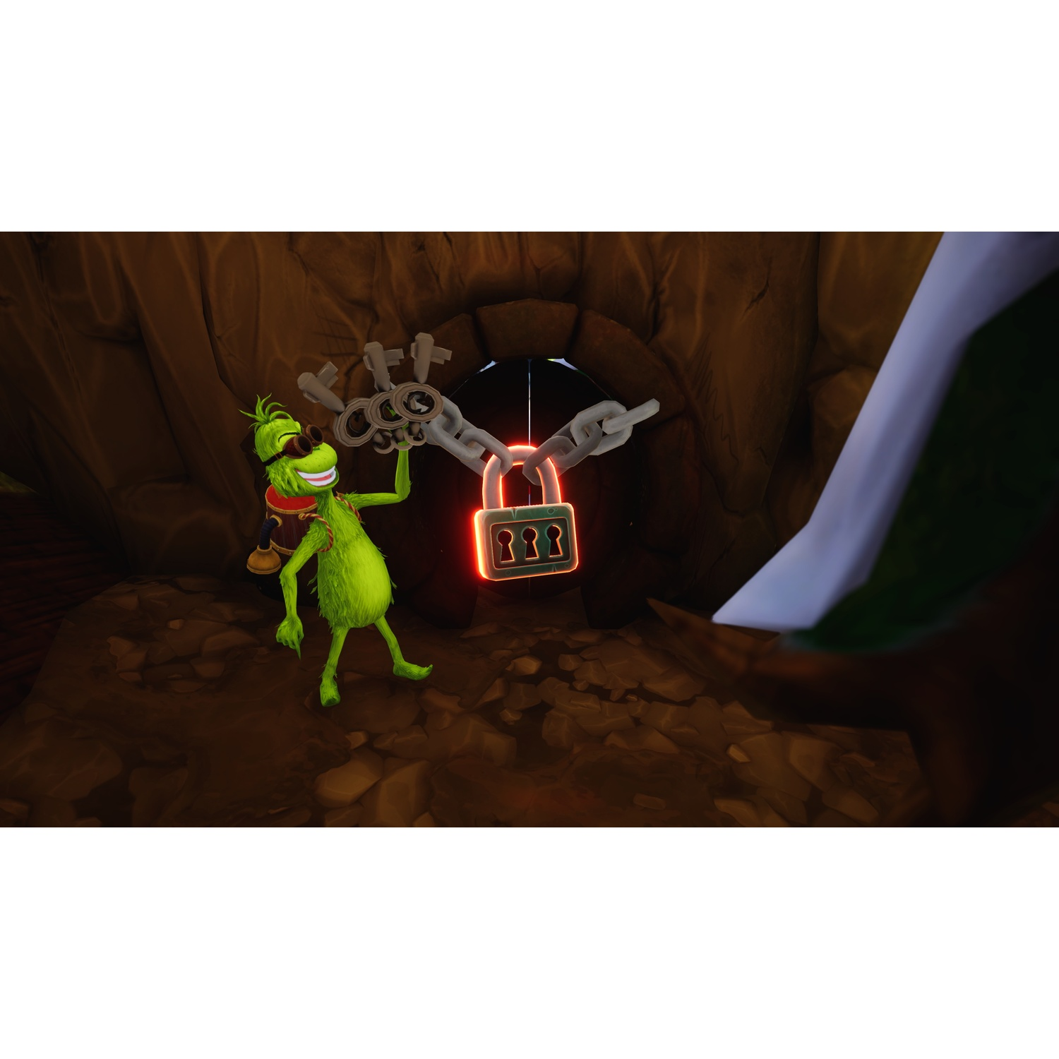 Green character holds a chain with a large glowing padlock in front of a cave entrance.