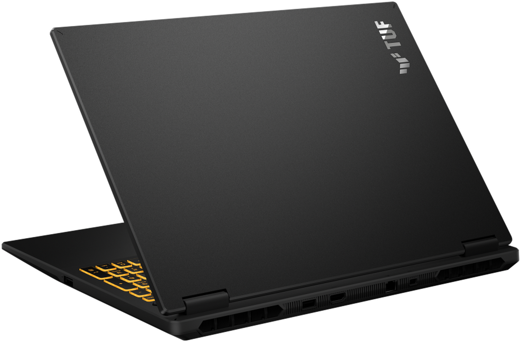 Un ordinateur portable Asus TUF noir avec clavier rétroéclairé jaune sur fond noir.