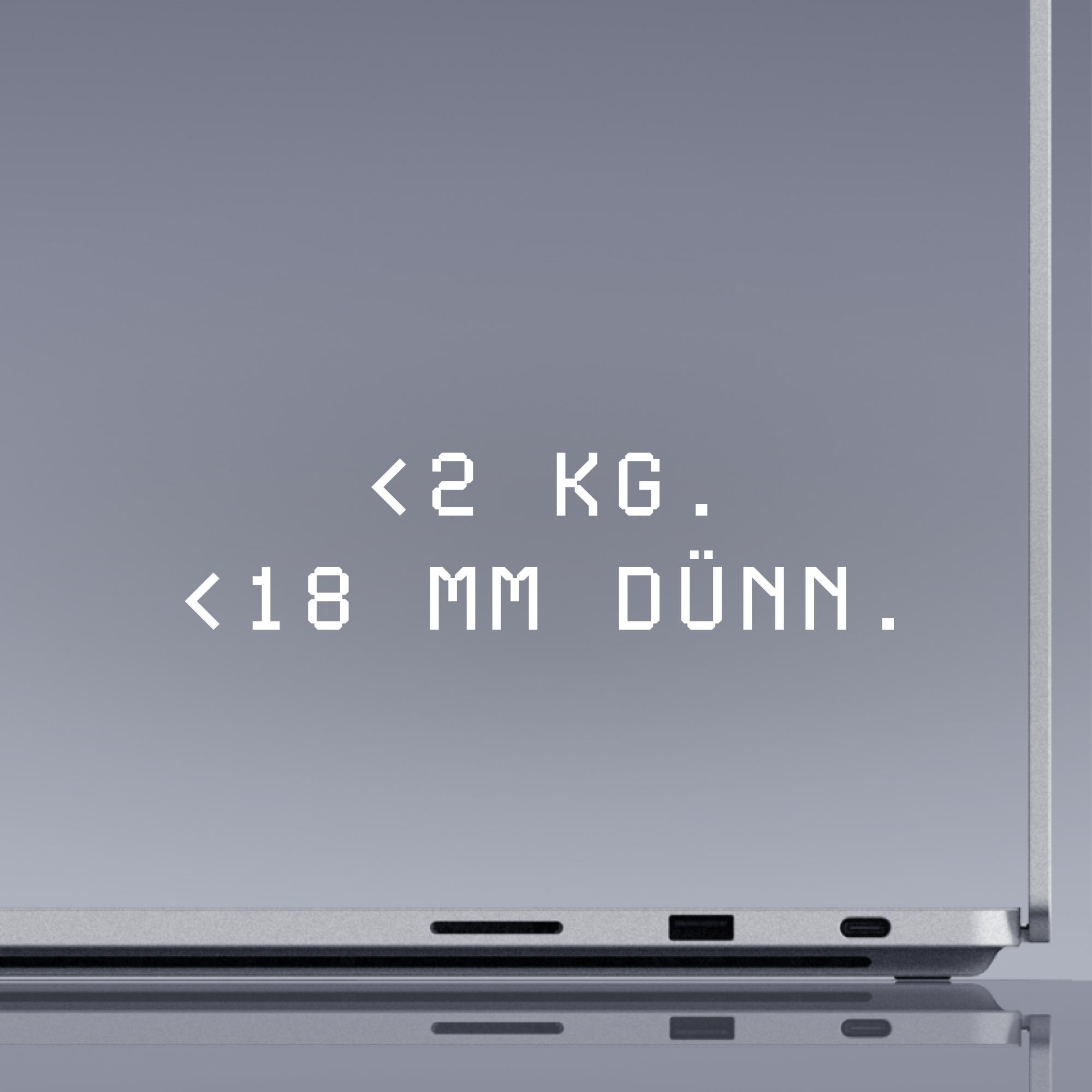 Laptop mit der Aufschrift <lt/>2 kg und <lt/>18 mm dünn auf dem grauen Bildschirm.
