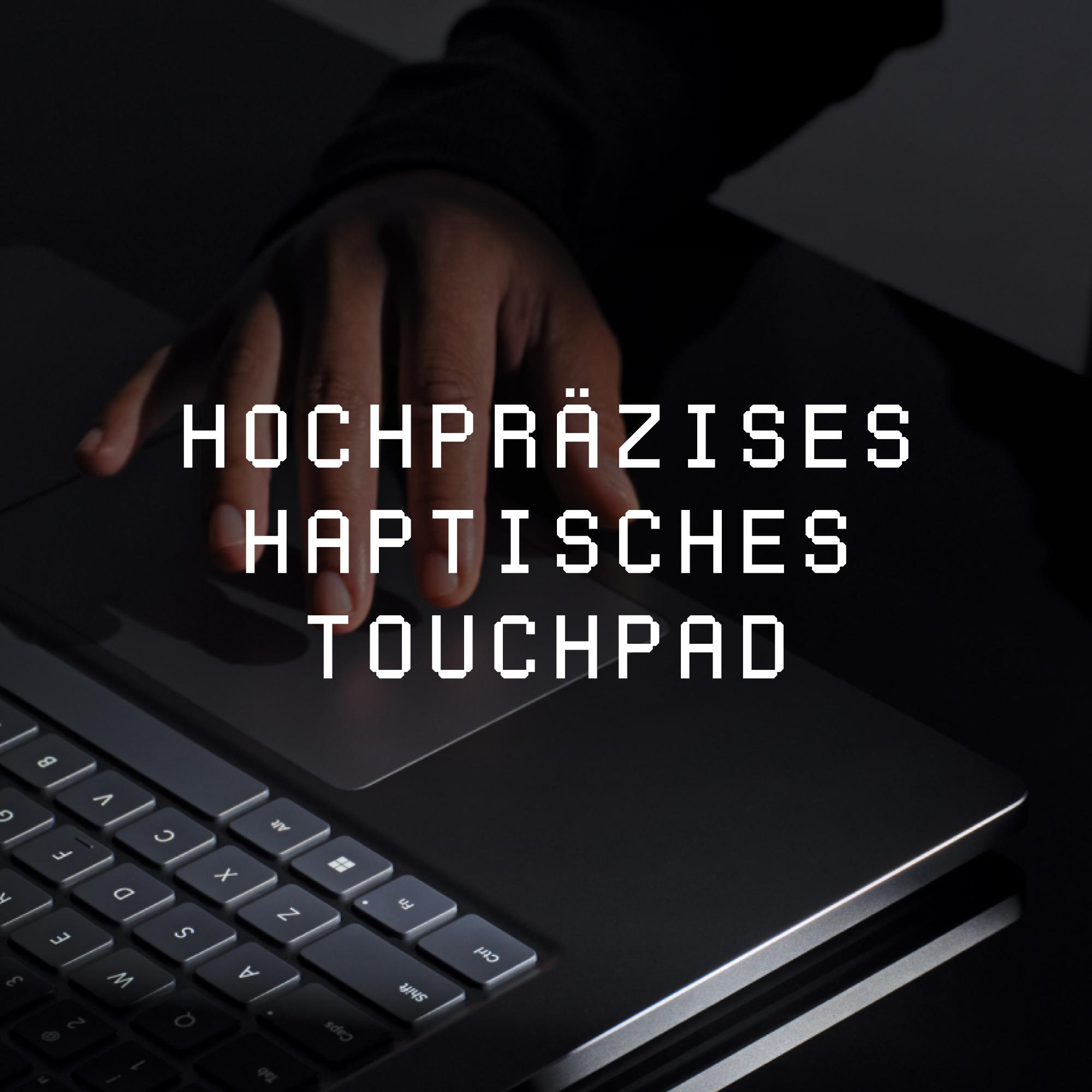 Hand tippt auf Laptop-Touchpad, mit dem Text HOCHPRÄZISES HAPTISCHES TOUCHPAD.