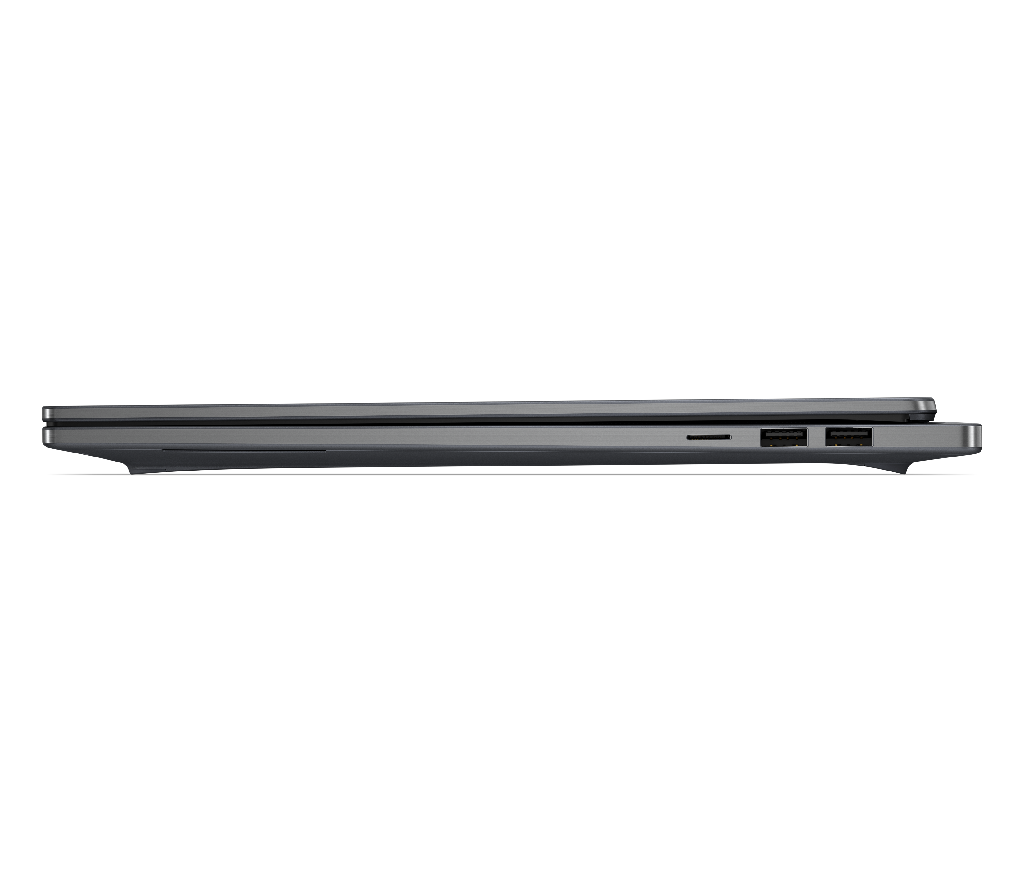 Seitenprofil eines geschlossenen dunklen Laptops mit sichtbaren USB-Anschlüssen.