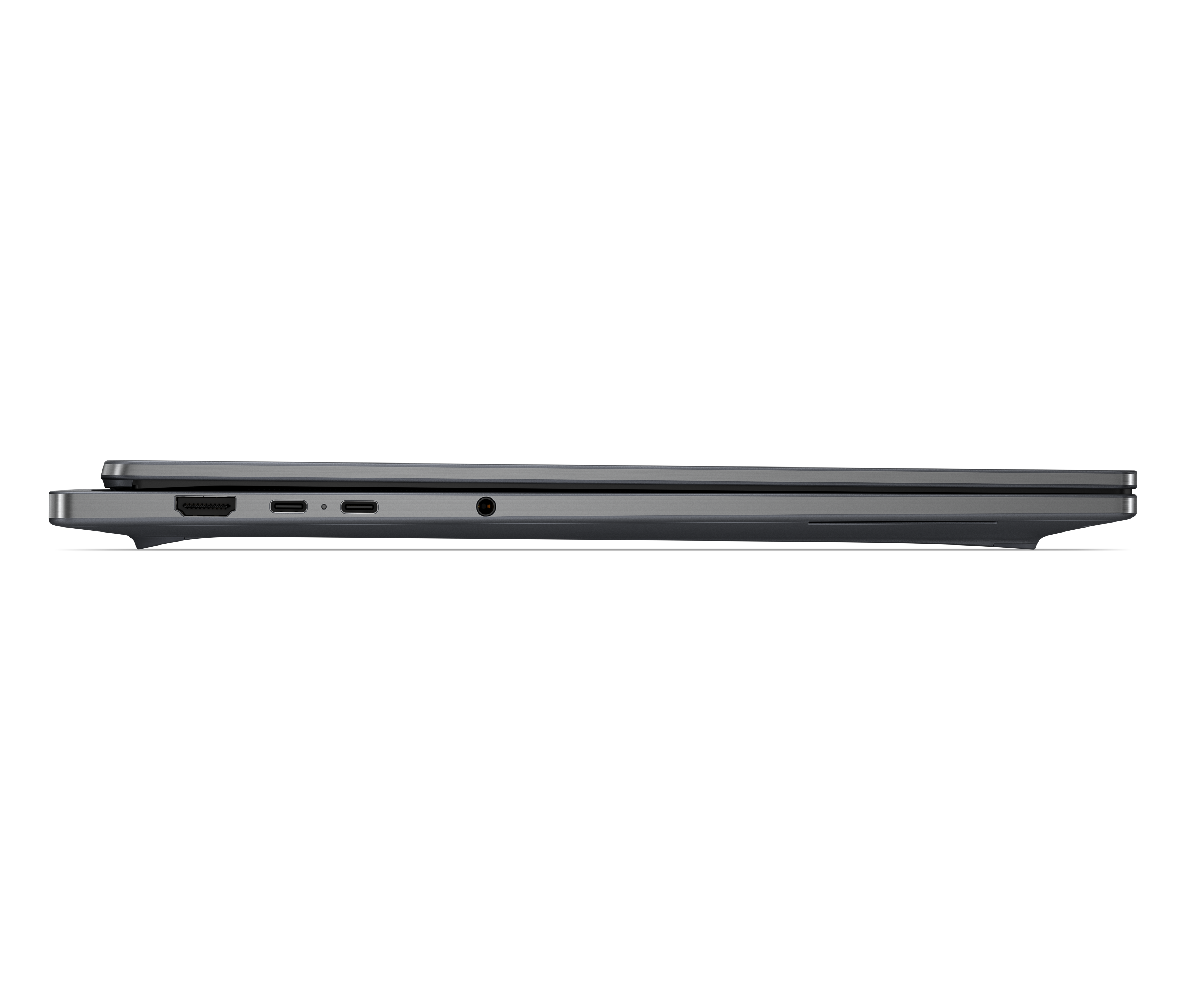 Seitenansicht eines geschlossenen grauen Laptops mit verschiedenen Anschlüssen auf schwarzem Hintergrund.