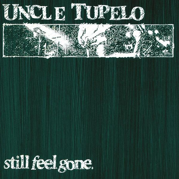 Albumcover mit grünem Holzmuster, weißem Text Uncle Tupelo und still feel gone, sowie einem grauen Fotostreifen.