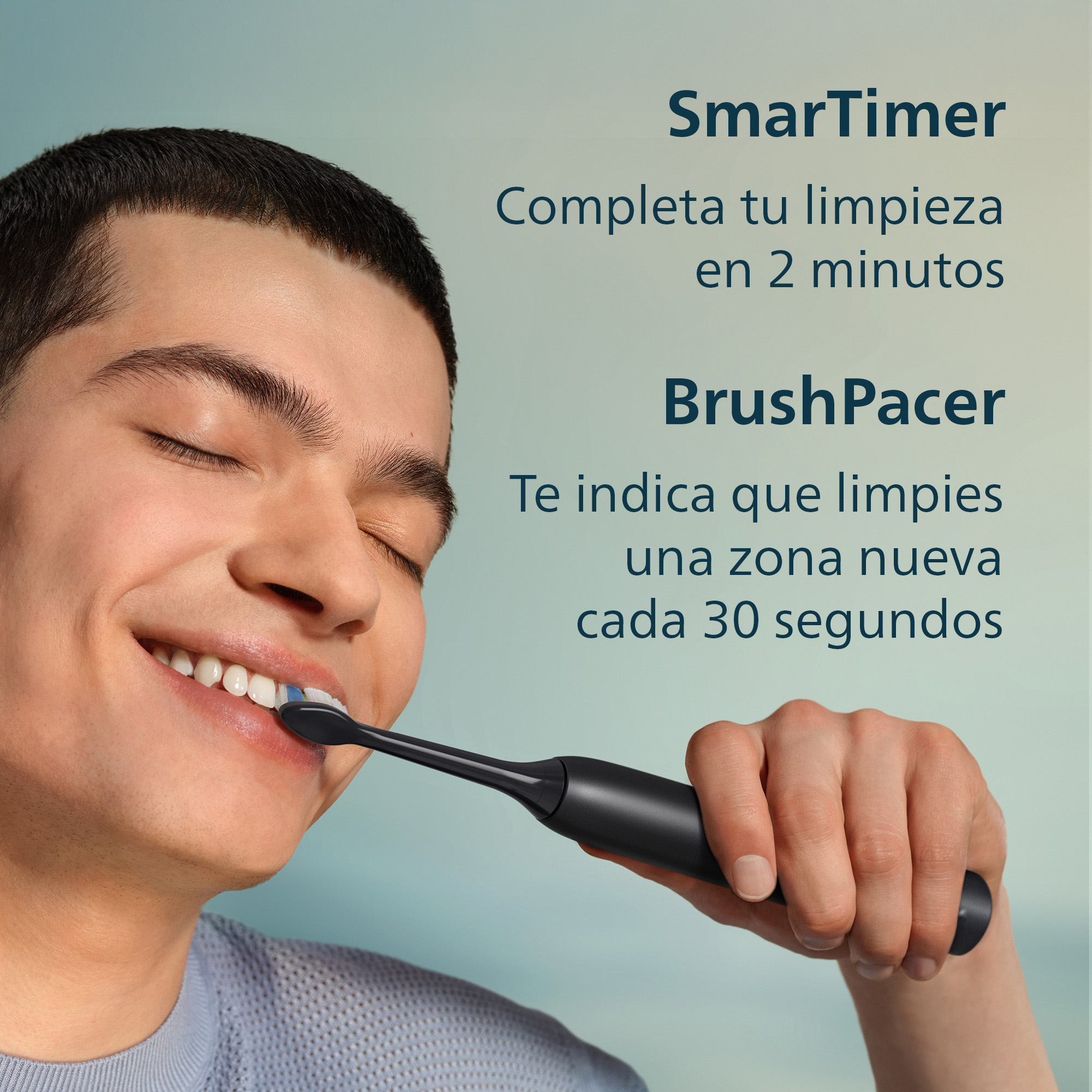 Un hombre joven se cepilla los dientes con un cepillo eléctrico negro. El texto explica características.