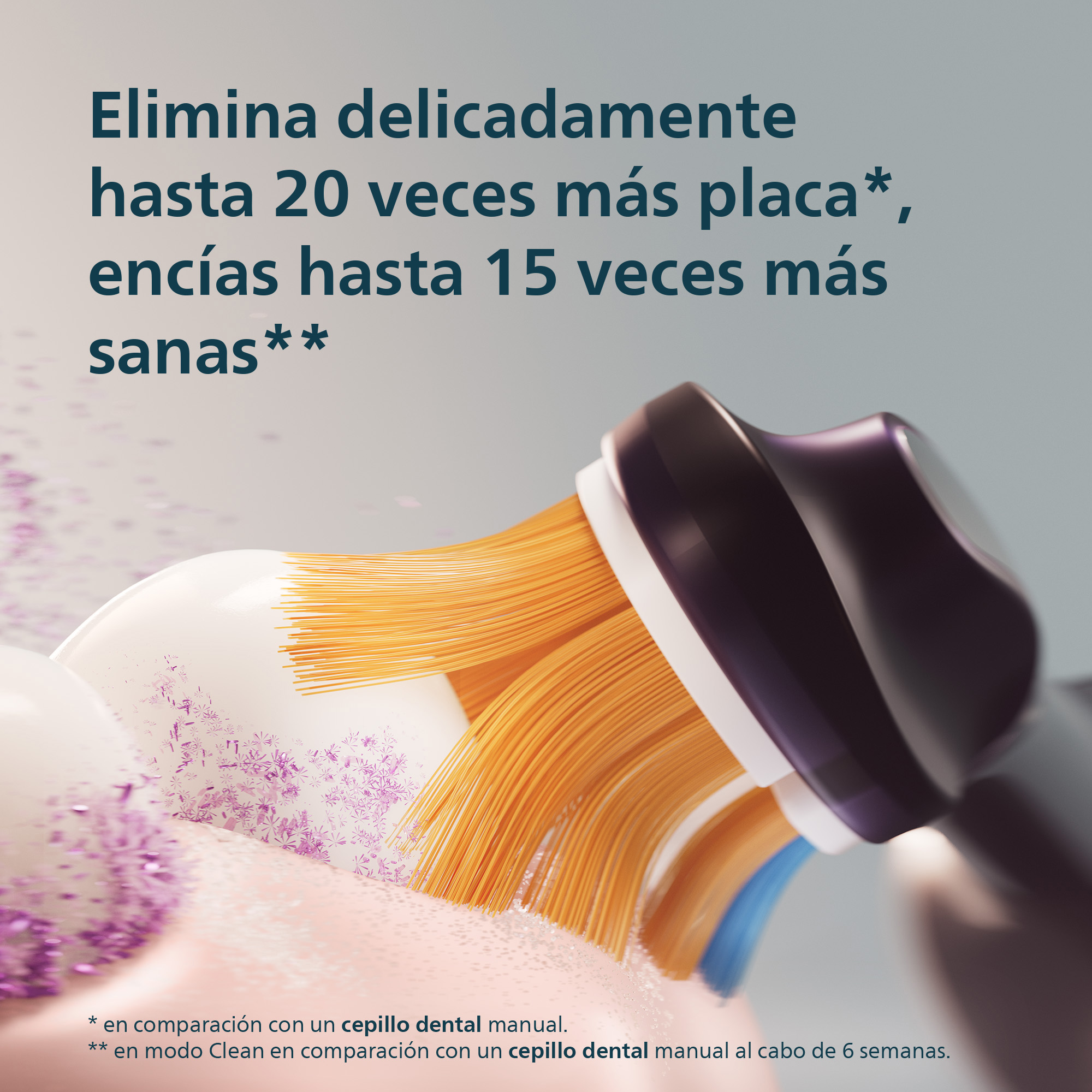 Un cabezal de cepillo eléctrico con cerdas naranjas limpiando dientes blancos con partículas moradas y texto.