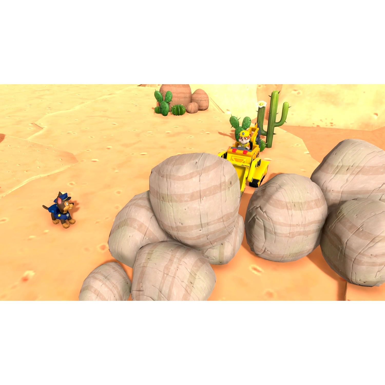 A yellow construction vehicle and a small dog stand in a sandy desert landscape among round boulders.