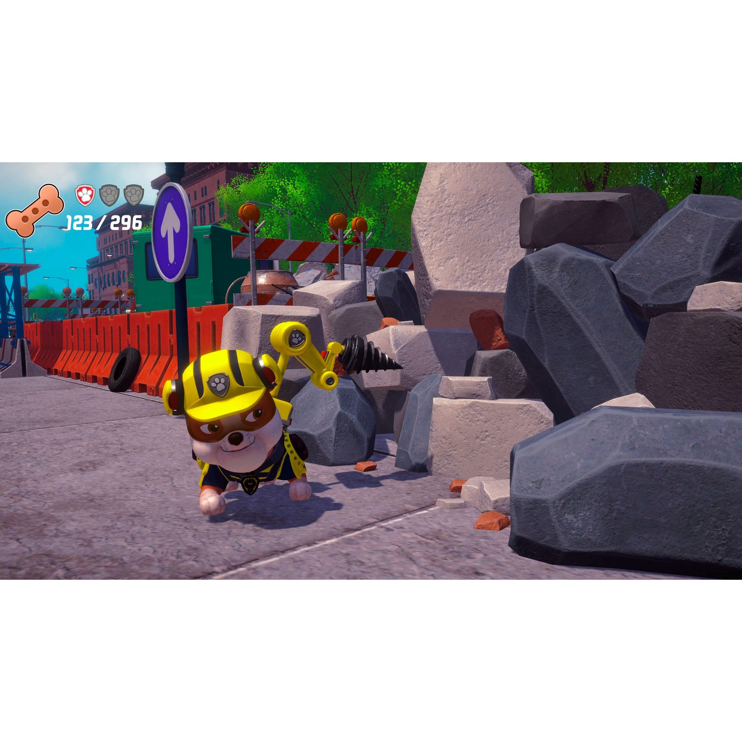 An animated dog with a yellow hard hat and robotic arm stands near large rocks at a construction site.