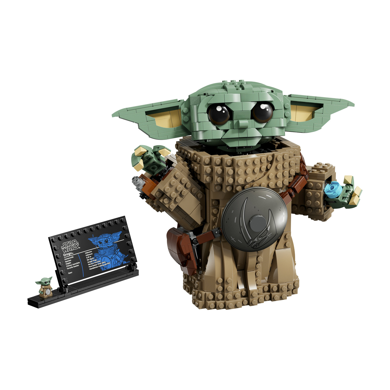 Figura Lego Star Wars Grogu con cappotto, scudo e targa informativa su sfondo bianco.