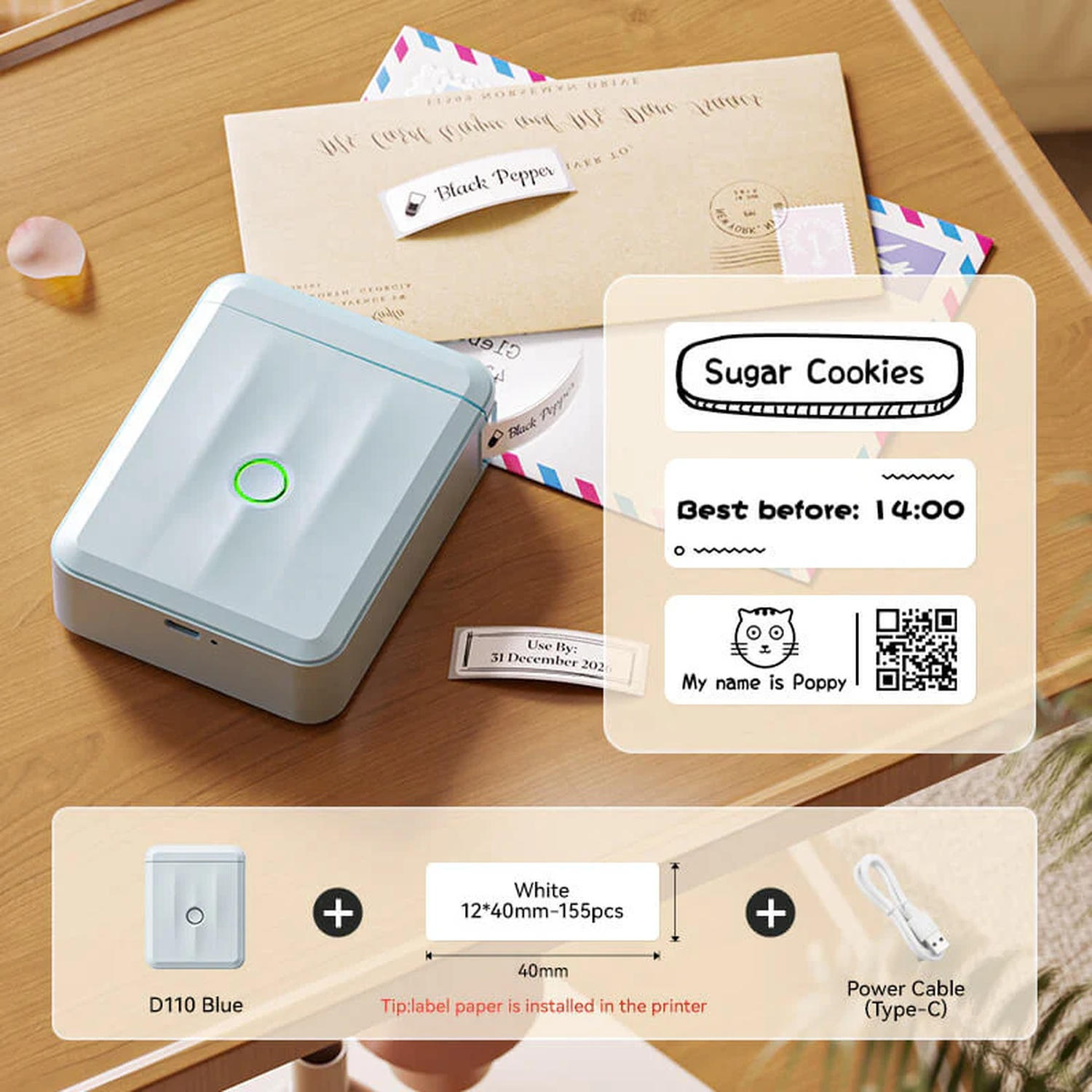 A light blue mini label printer on a wooden table with envelopes and printed labels.
