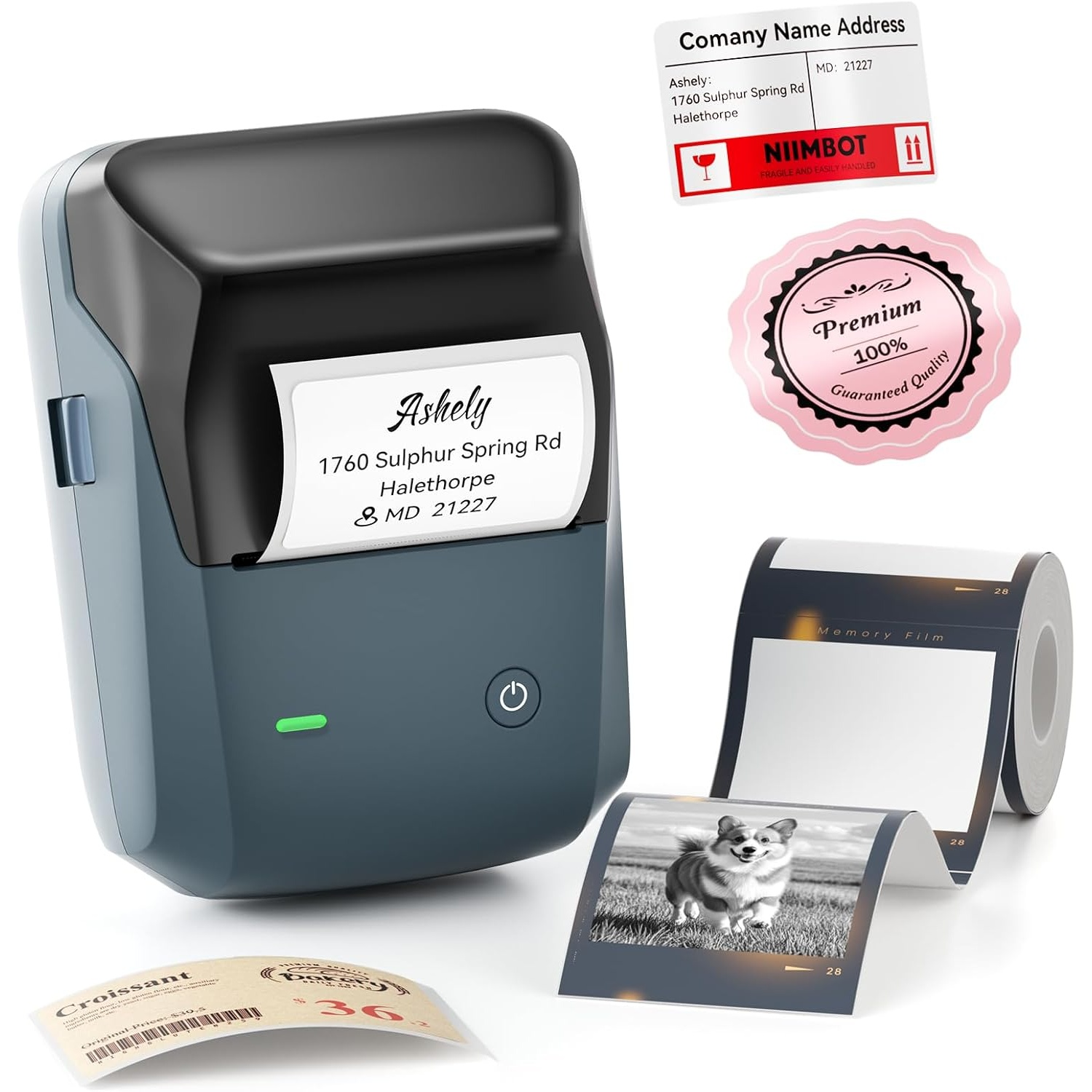 Blue portable label printer with a printed address label, photo roll, and various stickers surrounding it.