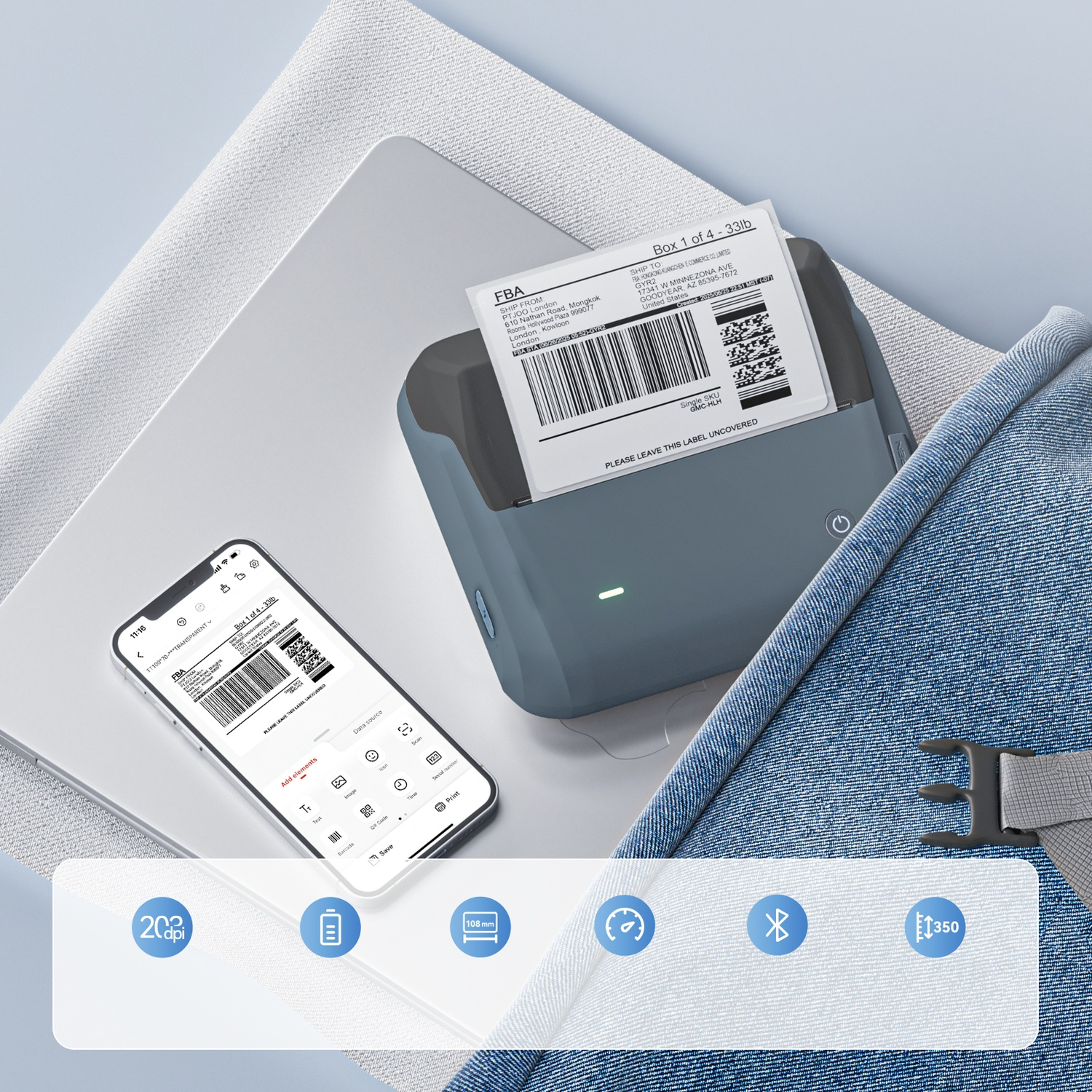 Portable label printer and smartphone showing a label design on a gray surface.