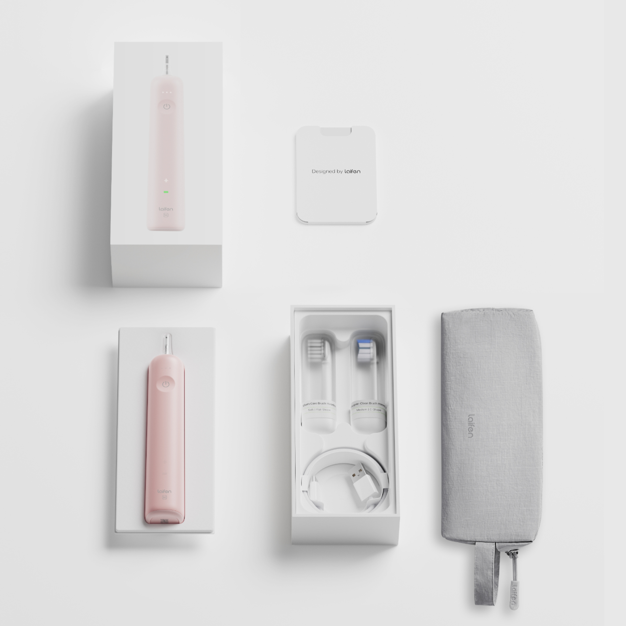 Eine pinke elektrische Zahnbürste mit Zubehör, Box und grauem Etui auf weißem Grund.