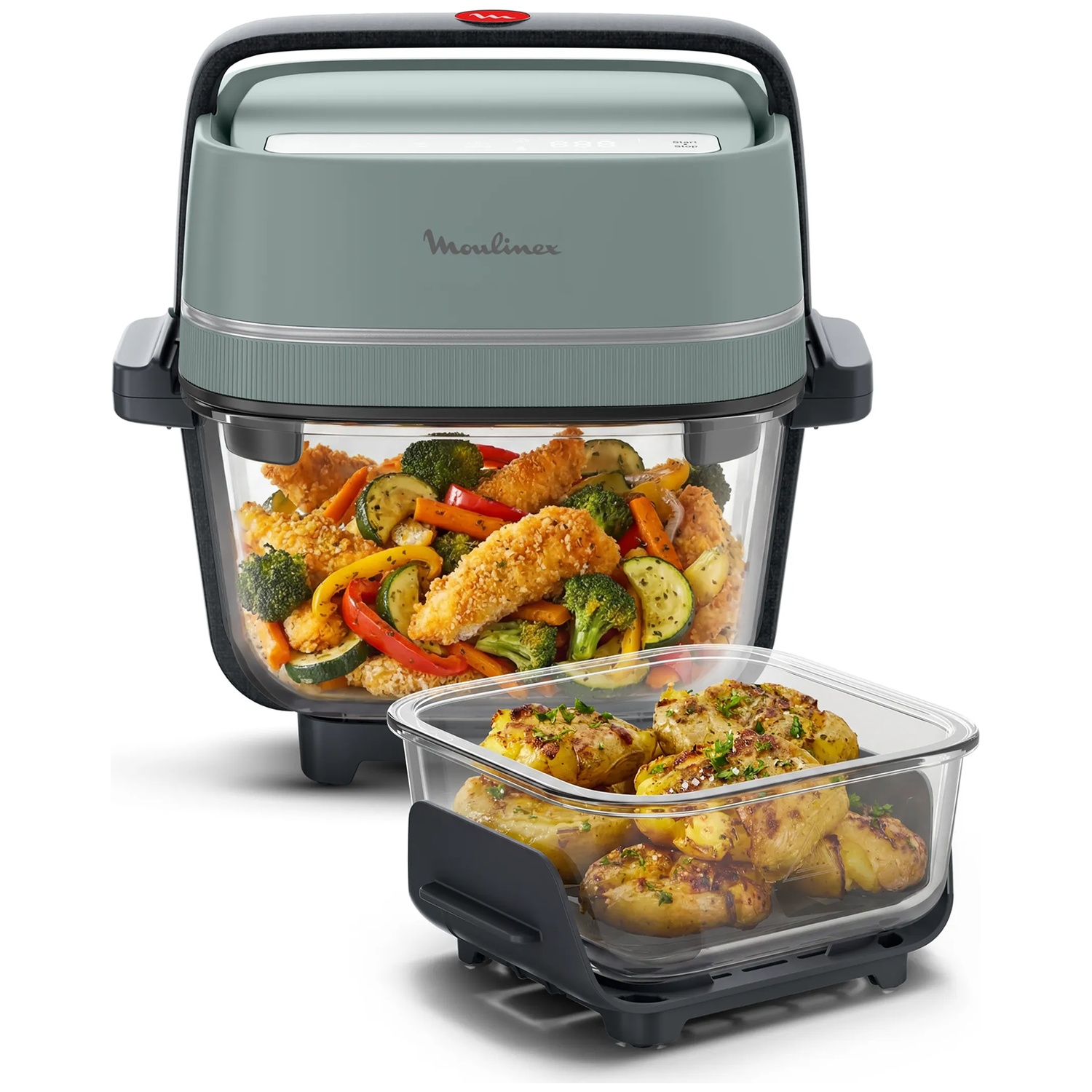 Moulinex airfryer met glazen bak gevuld met gefrituurde kip, groenten en aardappelen.