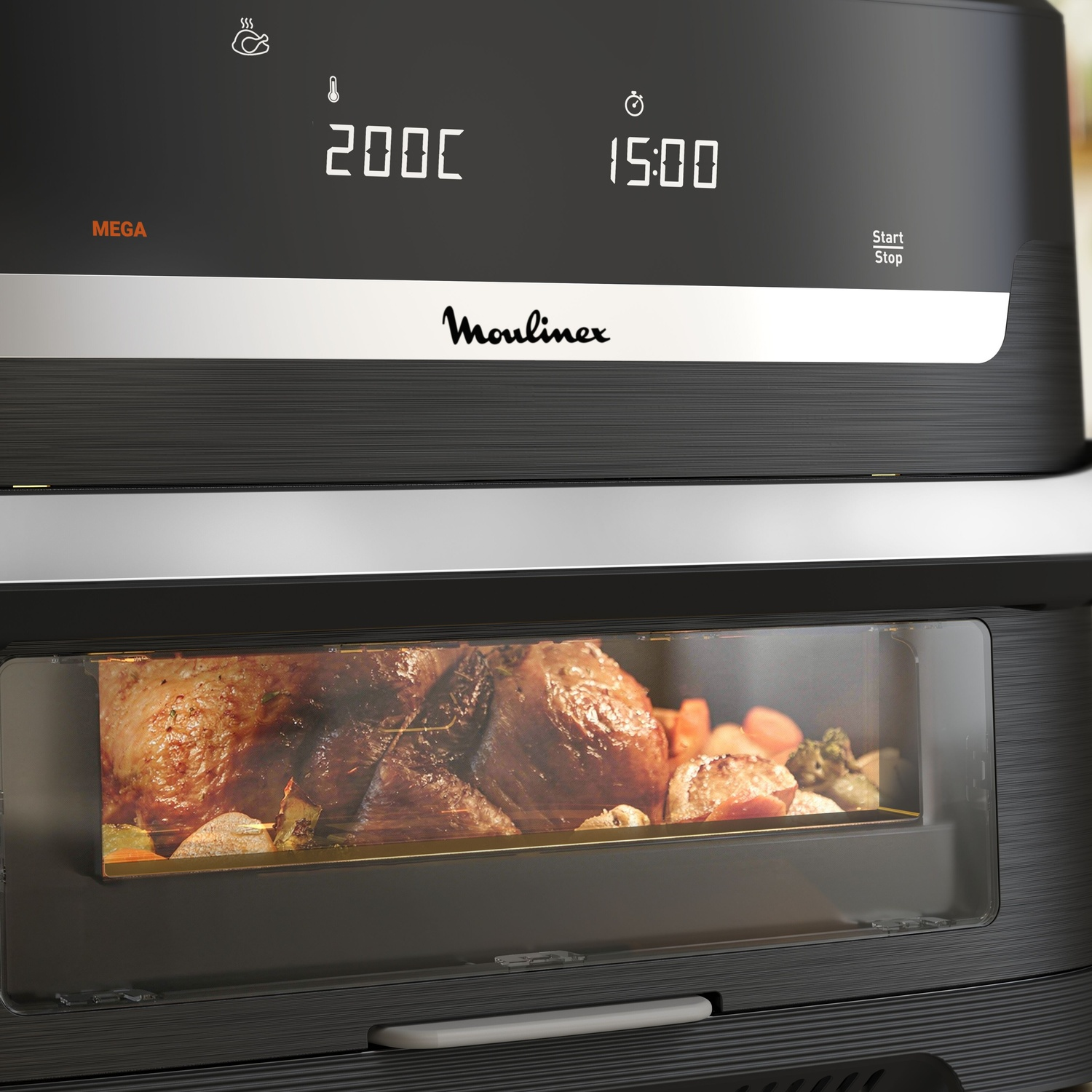 Een Moulinex airfryer toont 200°C en 15 min, met kip en groenten zichtbaar door het glazen venster.