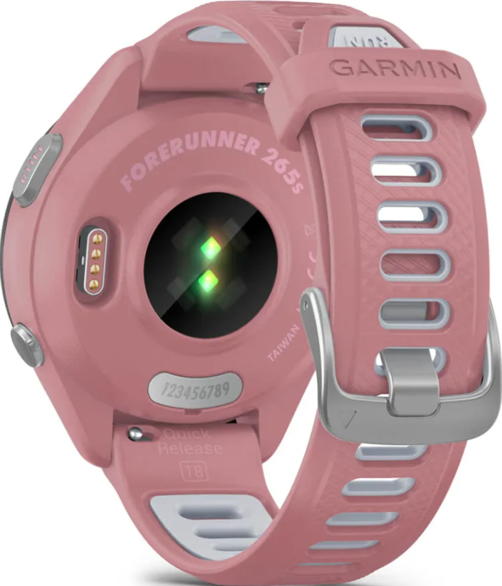 Rückseite einer rosafarbenen Garmin Forerunner 265s Smartwatch mit Herzfrequenzsensor und Armband.