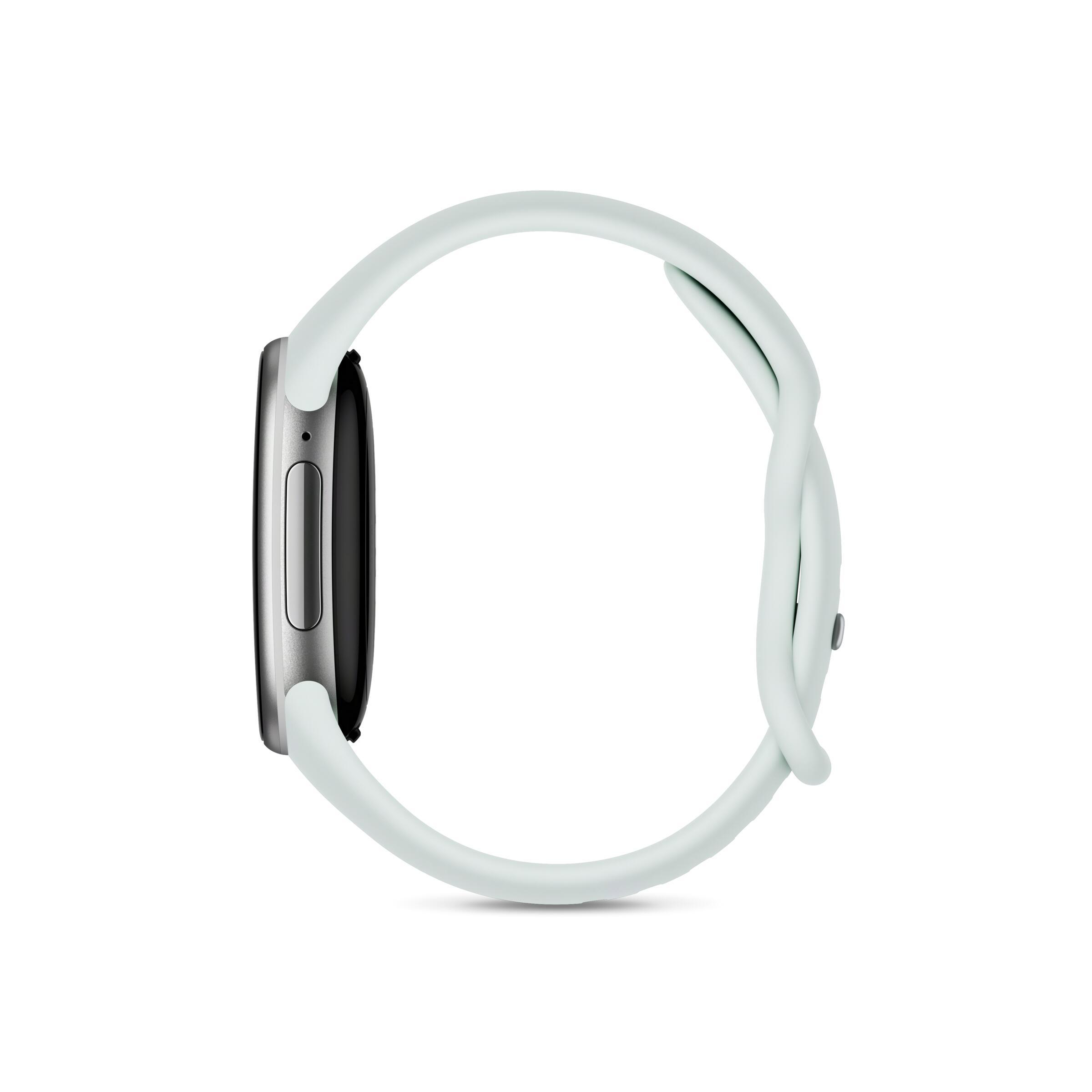 Eine Smartwatch mit silbernem Gehäuse und einem hellgrünen Armband wird von der Seite auf weißem Hintergrund gezeigt.