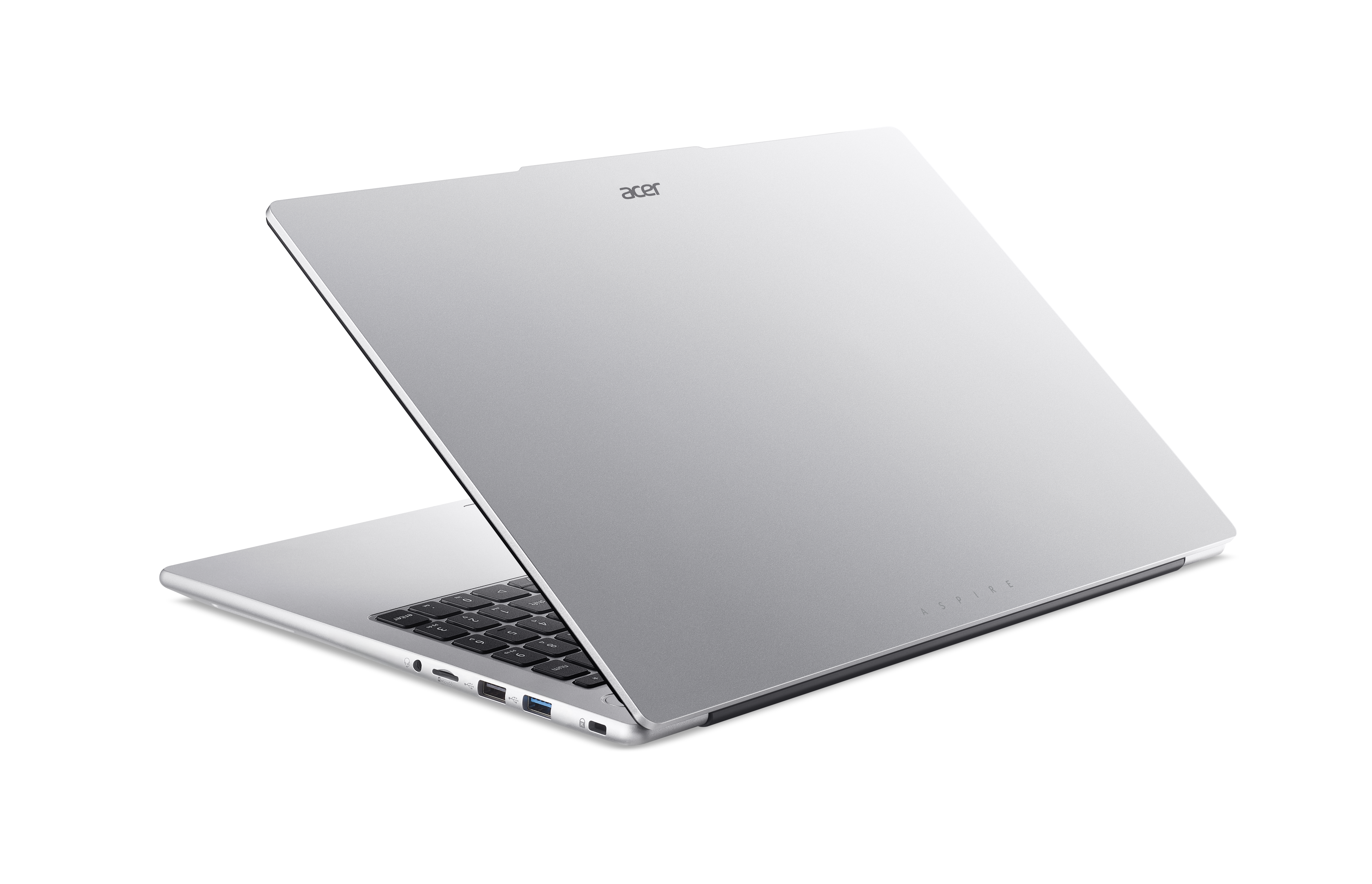 Ein silberner Acer Aspire Laptop steht auf einer schwarzen Oberfläche, mit sichtbaren Anschlüssen an der Seite.