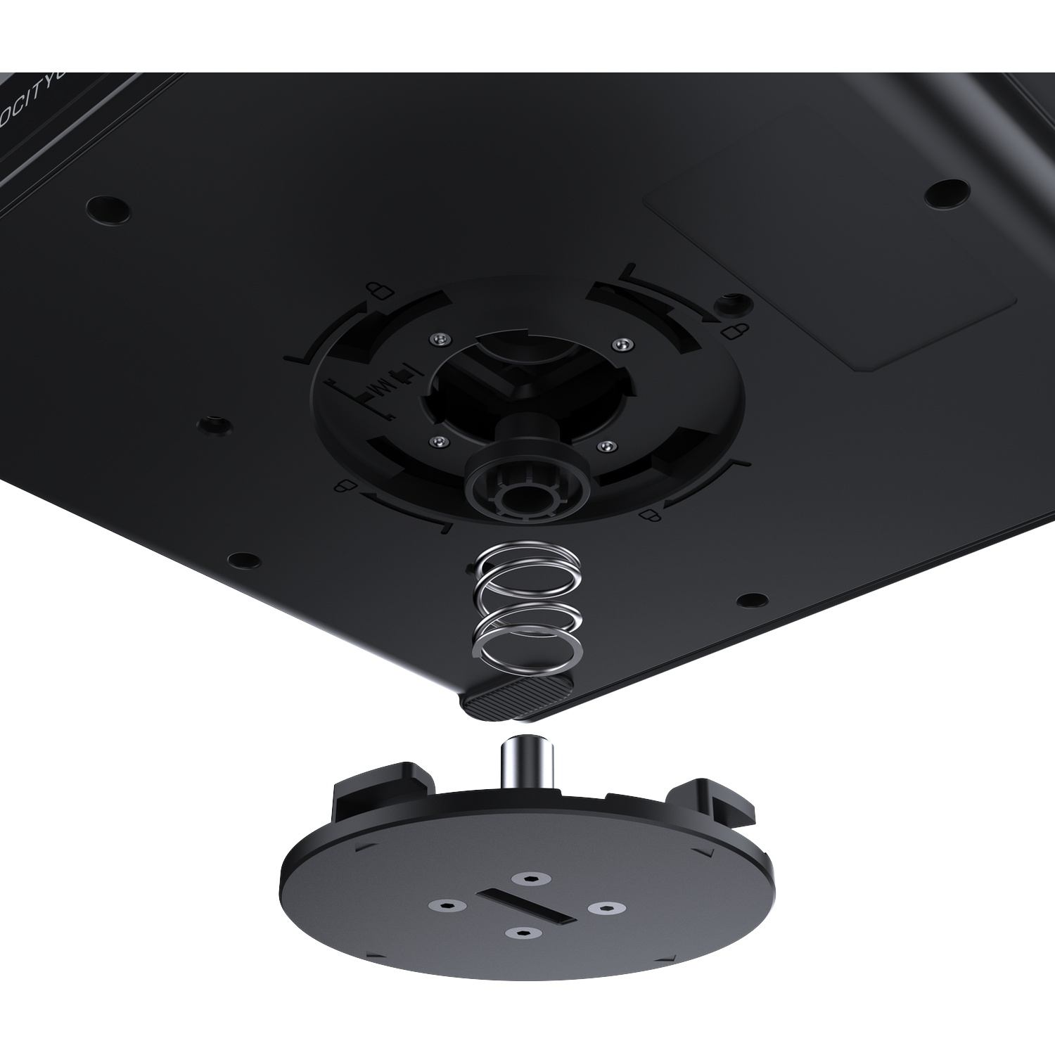 Bottom of a black device showing a detached base, locking mechanism, and a metal spring.