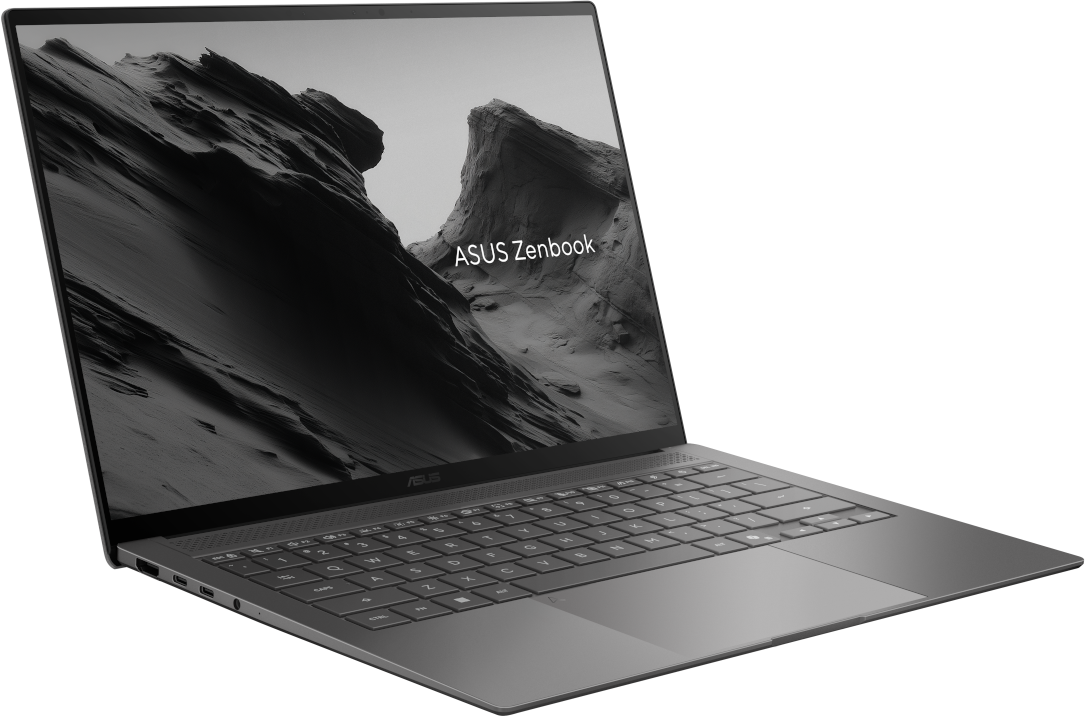 Egy szürke ASUS Zenbook laptop fekete háttér előtt, hegyi táj háttérképpel a képernyőn.