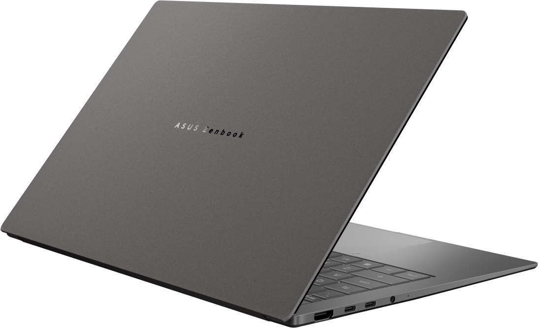 Egy szürke ASUS Zenbook laptop nyitva áll fekete háttér előtt.