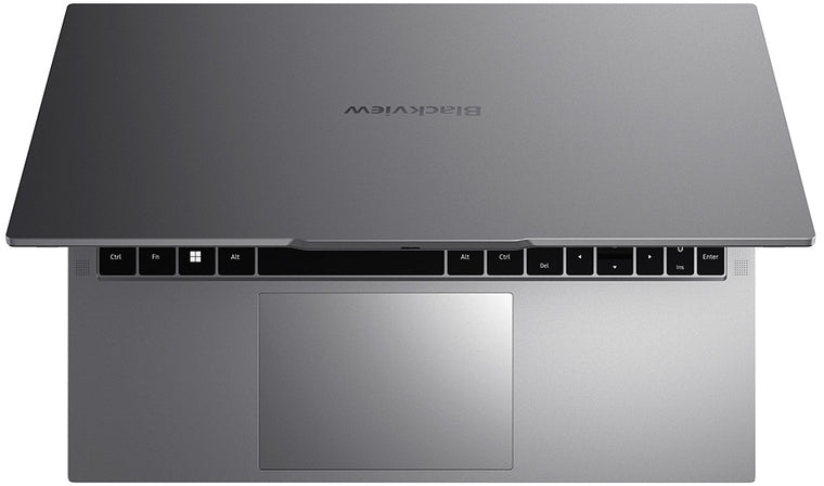 Szürke laptop felülről nézve, billentyűzettel és érintőpaddal.