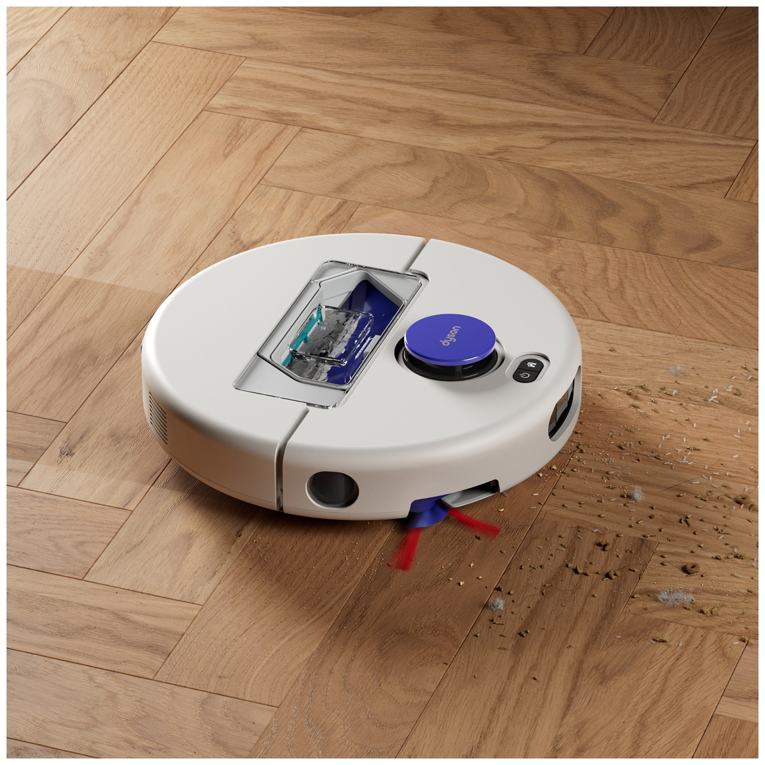 Een witte robotstofzuiger reinigt een visgraat houten vloer en zuigt vuil op.