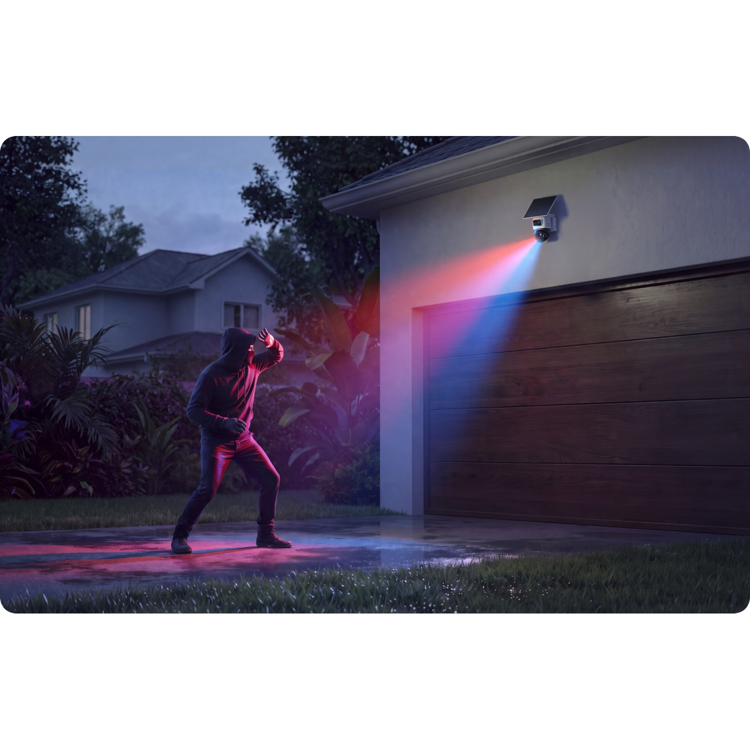 A security camera shines red and blue light on a person in a hooded jacket in front of a garage.