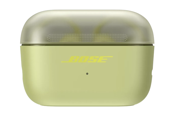 Ein geschlossenes, hellgrünes Bose-Ohrhörer-Ladecase mit einem halben transparenten Deckel und dem Bose-Logo.