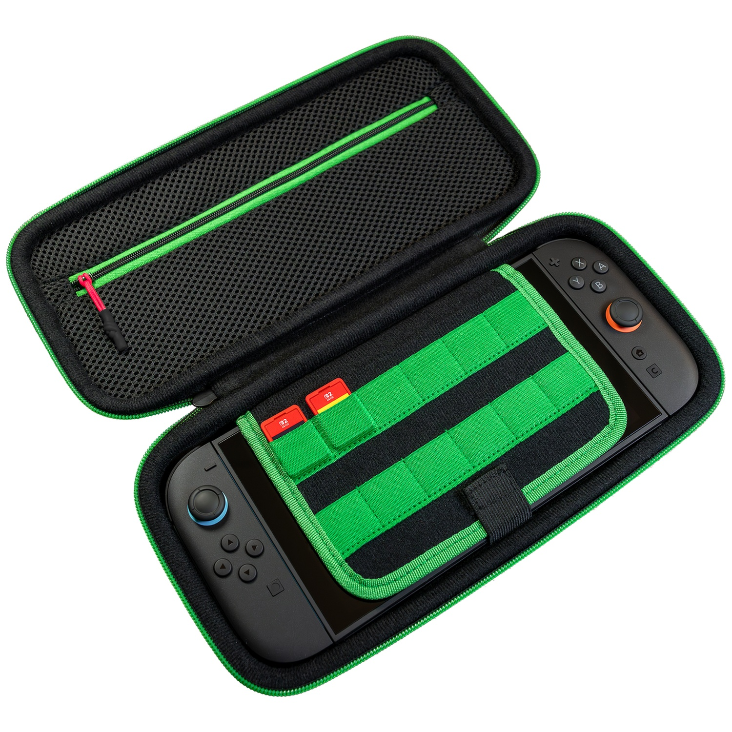 Open black and green gaming console case containing a console and two small red cards.