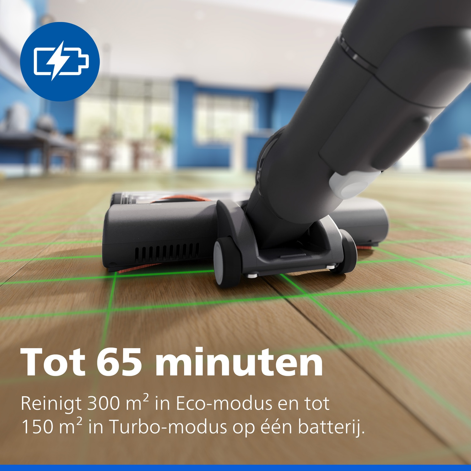 Cordless vacuum cleaner on wooden floor with green grid lines and text.