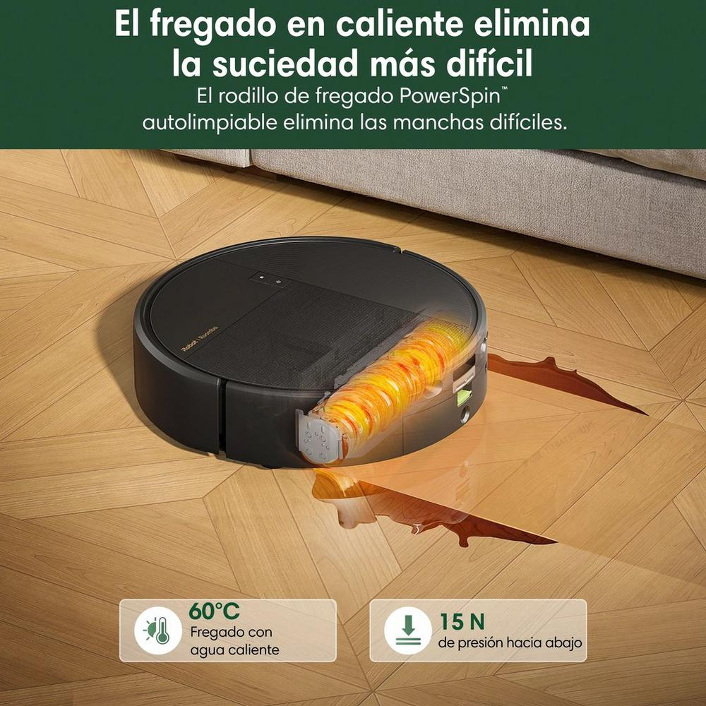 Un robot aspirador negro limpia un suelo de madera con un rodillo giratorio caliente.