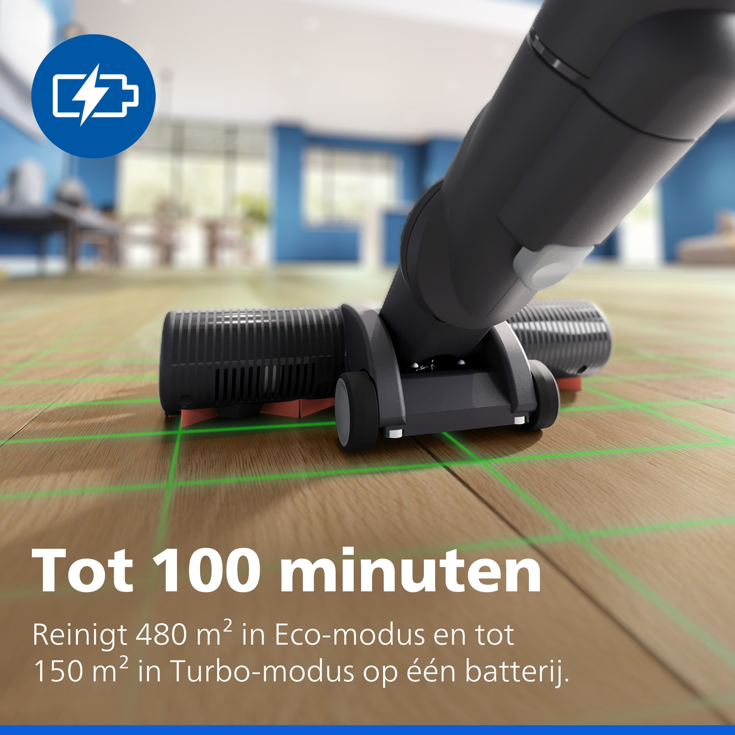 A black cordless vacuum cleaner nozzle on wooden flooring with green grid lines, and Dutch text at the bottom.