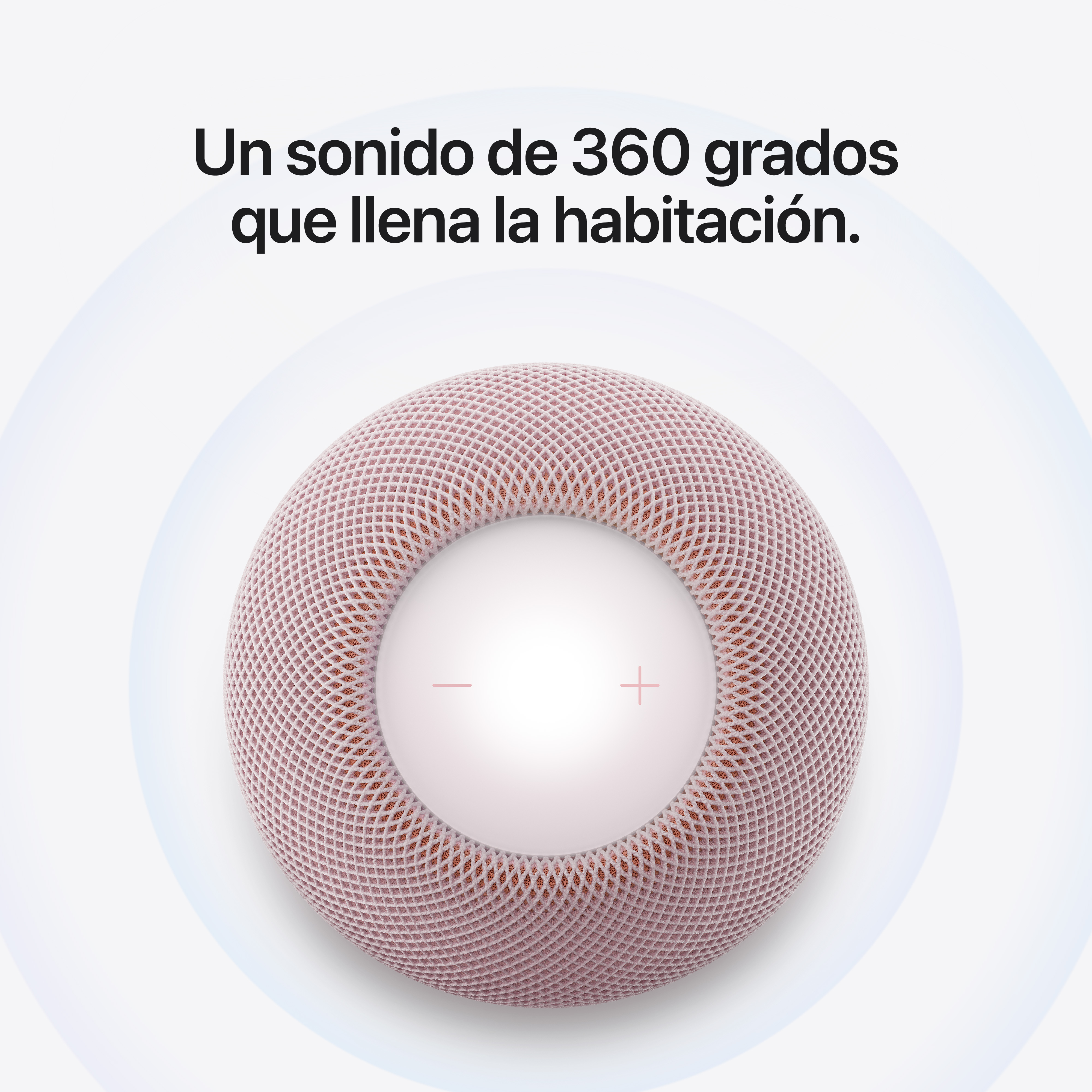 Vista superior de un altavoz inteligente redondo rosa con pantalla integrada y texto en español arriba.