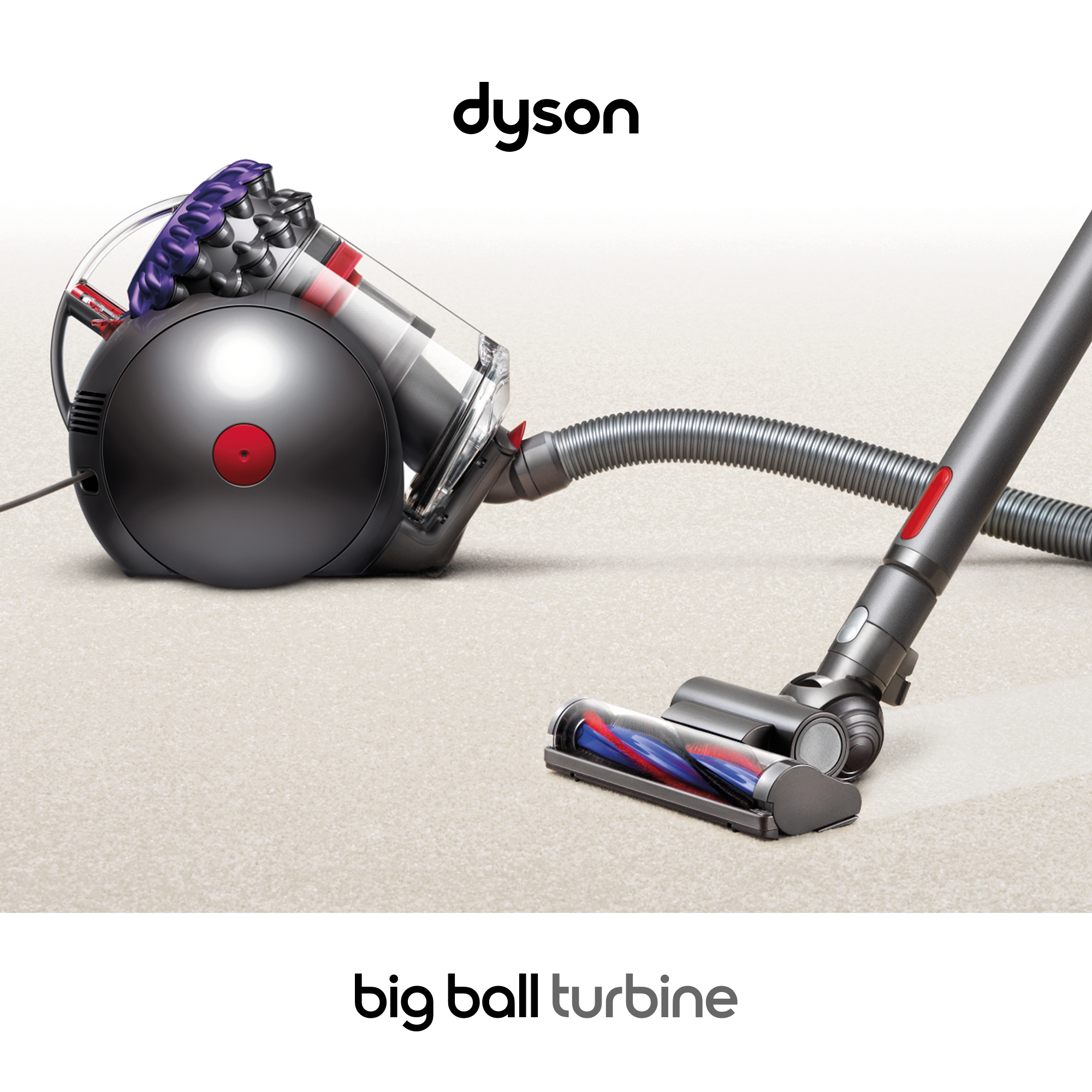 Hortumlu ve fırçalı açık renk halı üzerinde Dyson Big Ball Turbine süpürge.