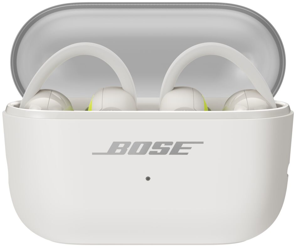 Écouteurs Bose blancs avec crochets d'oreille dans un étui de chargement ouvert.